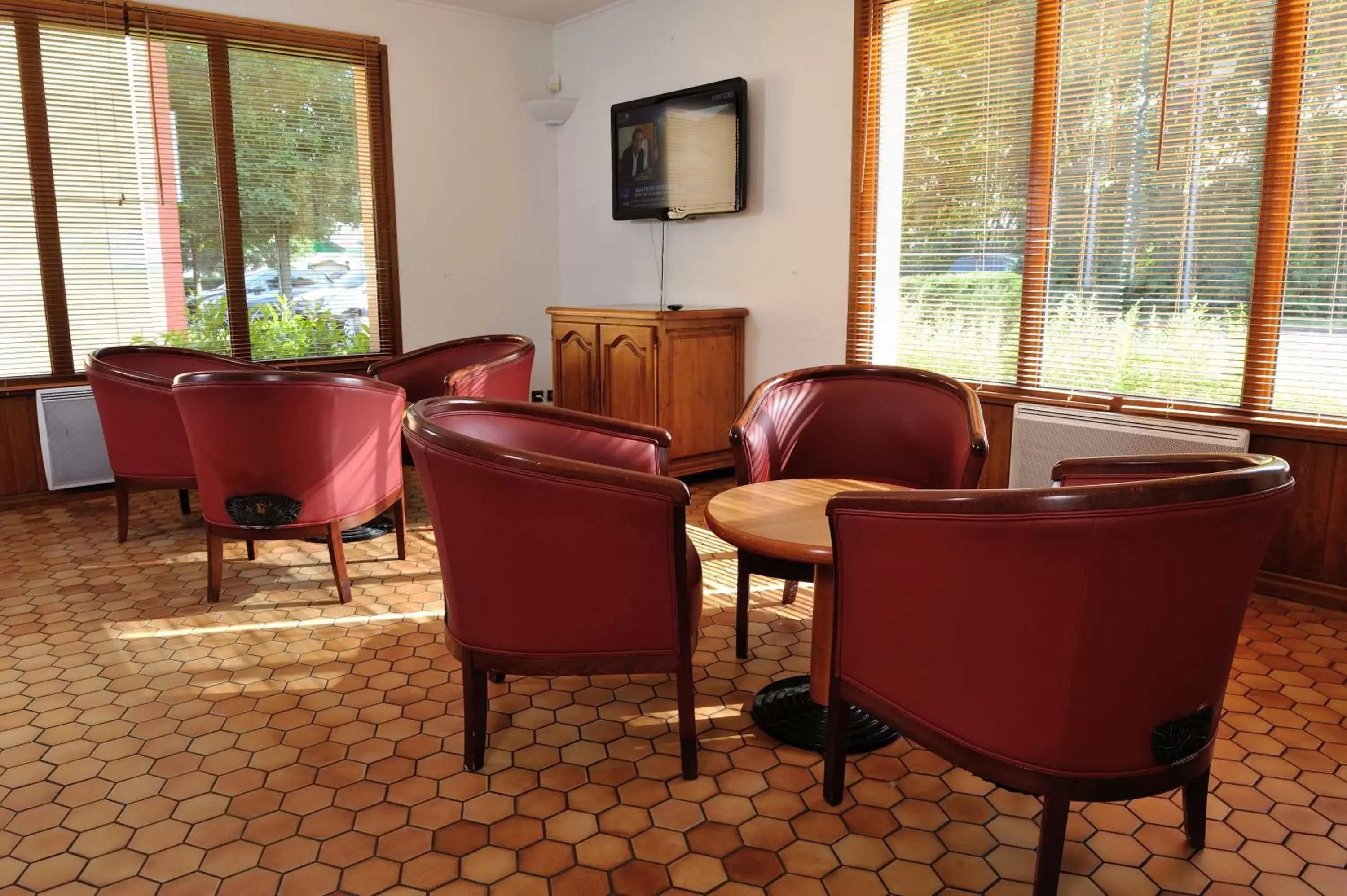 Communal lounge/ TV room in Kyriad Direct Nancy Est - Essey