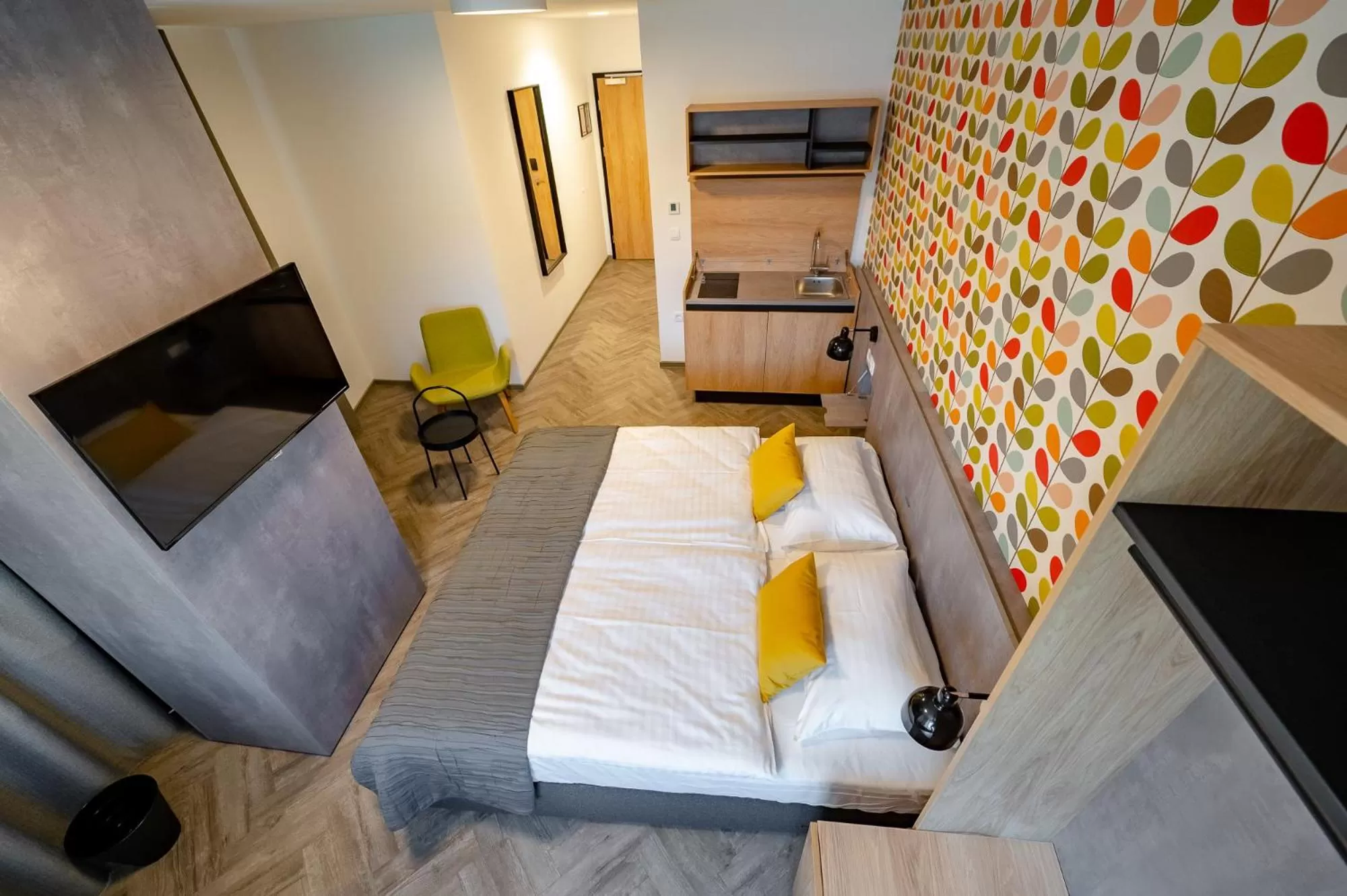 Kitchen or kitchenette, Bed in Urban Ring Hotel