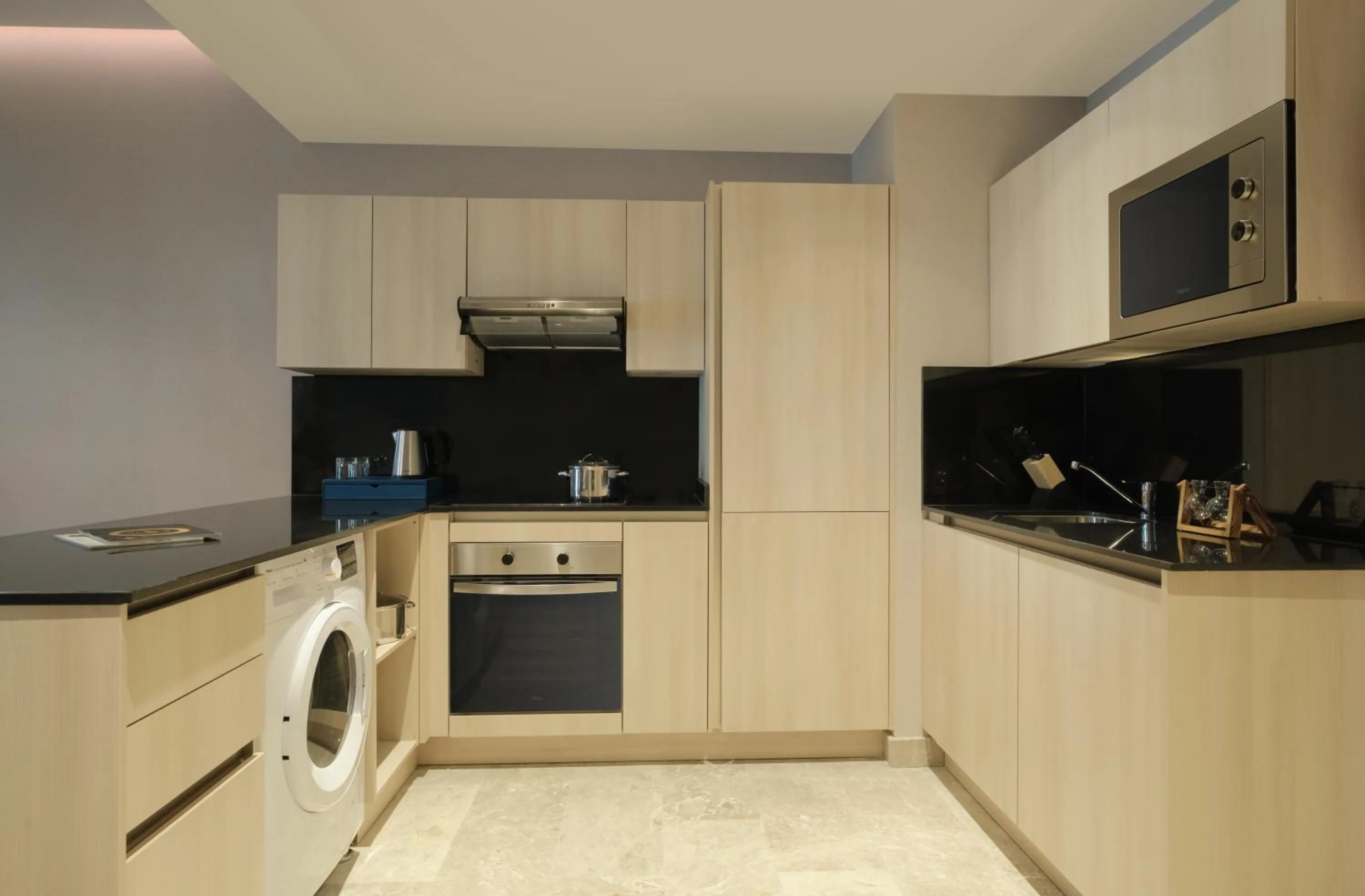 Kitchen or kitchenette in Maani Muscat Hotel & Apartments