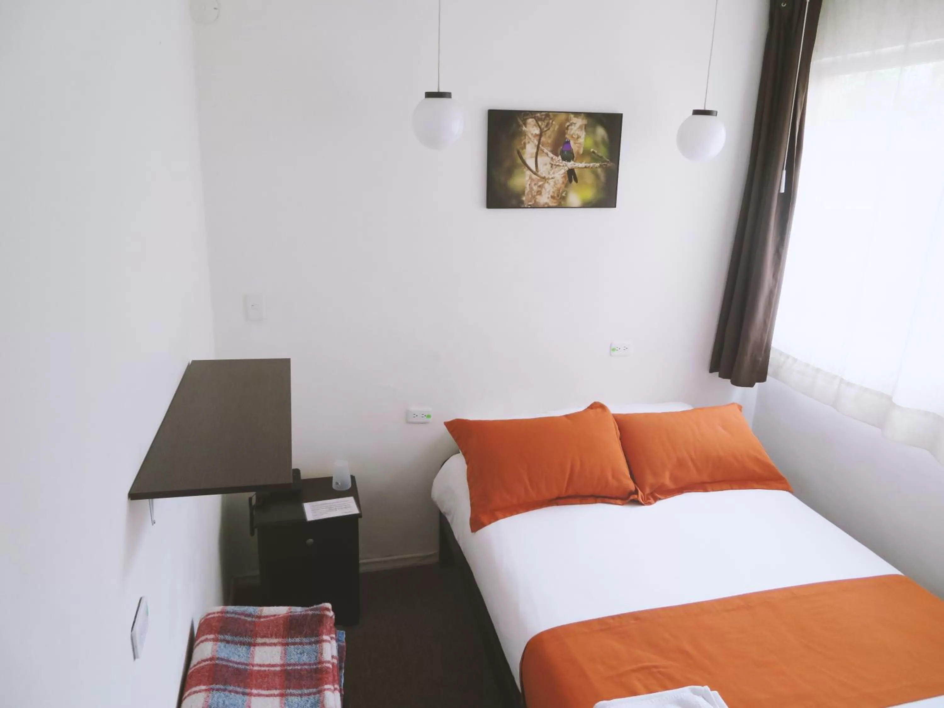 Bed in Bird Garden Guest House