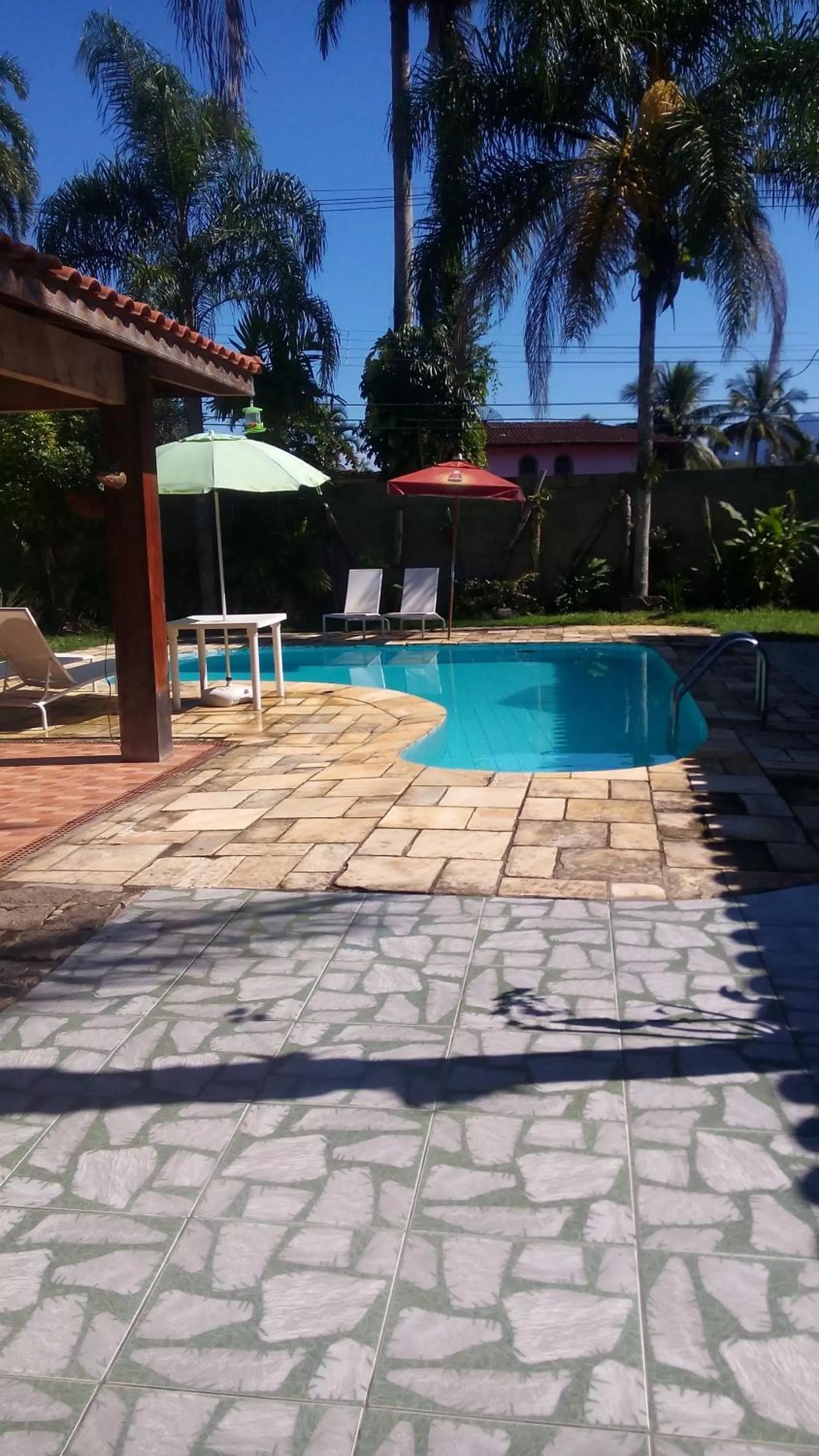 Swimming pool in Pousada Na Praia Ubatuba