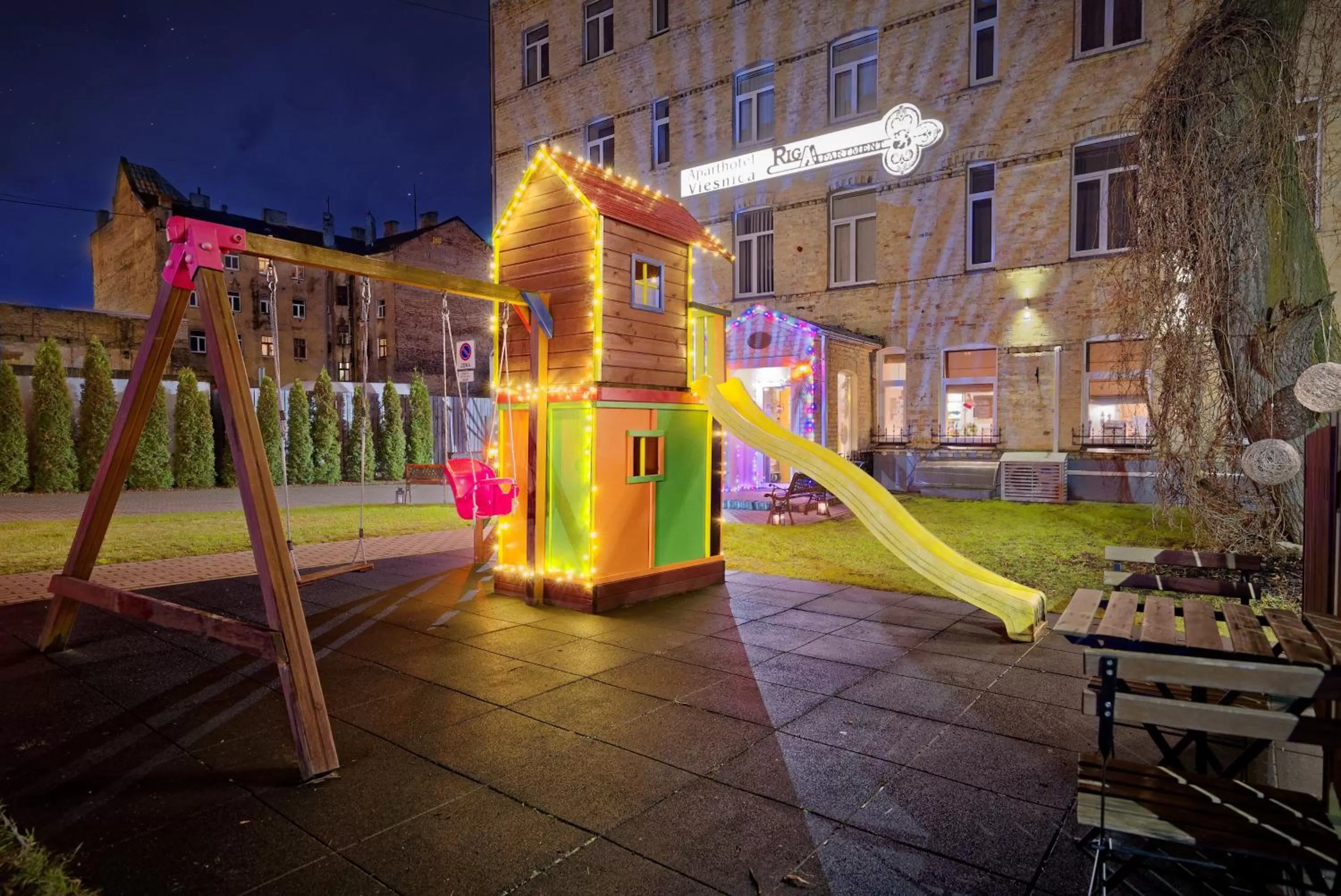 Children play ground in RIGAAPARTMENT SONADA Family Aparthotel - Private Parking