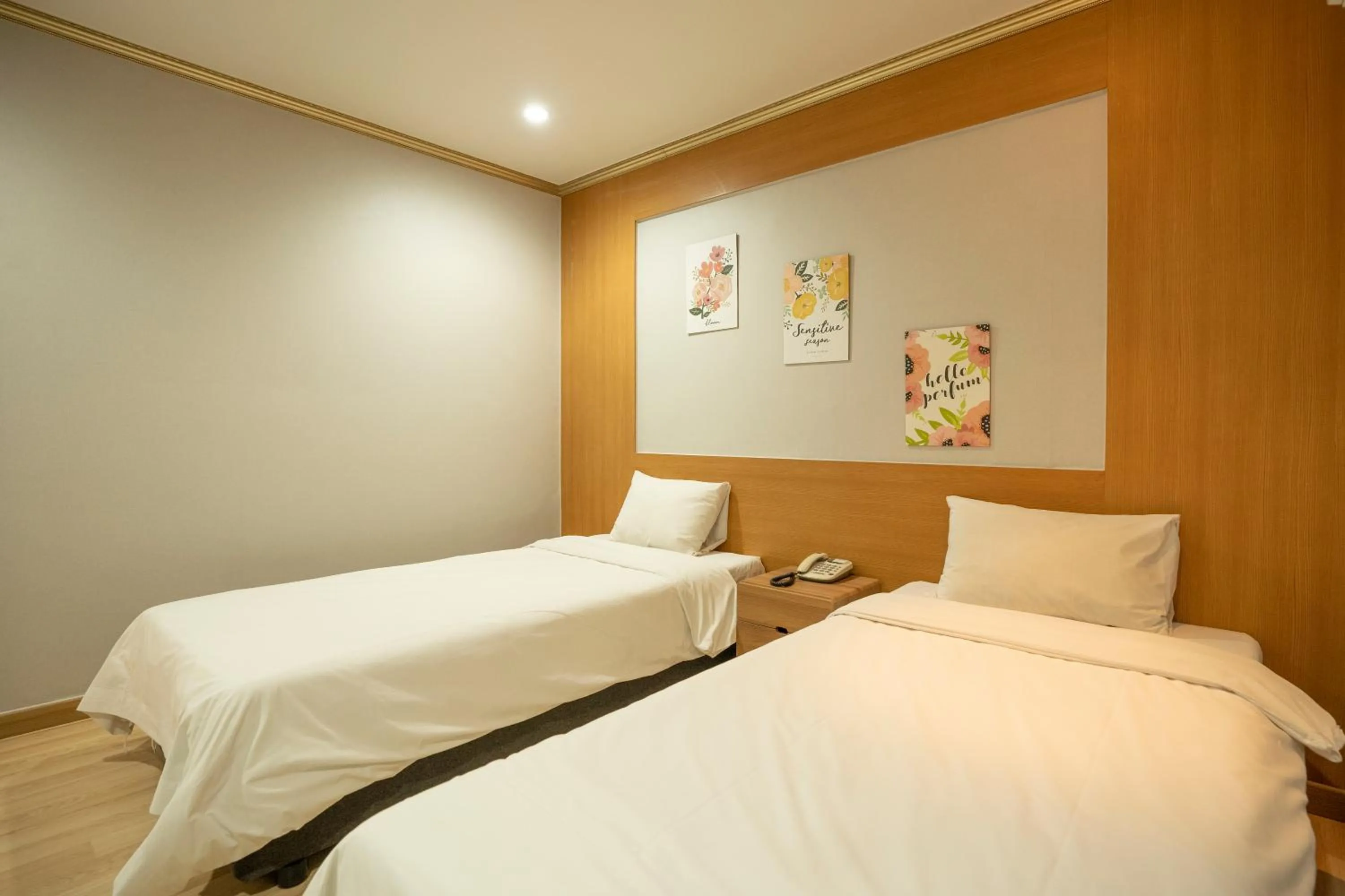 Bed in Jeju Stay Hotel