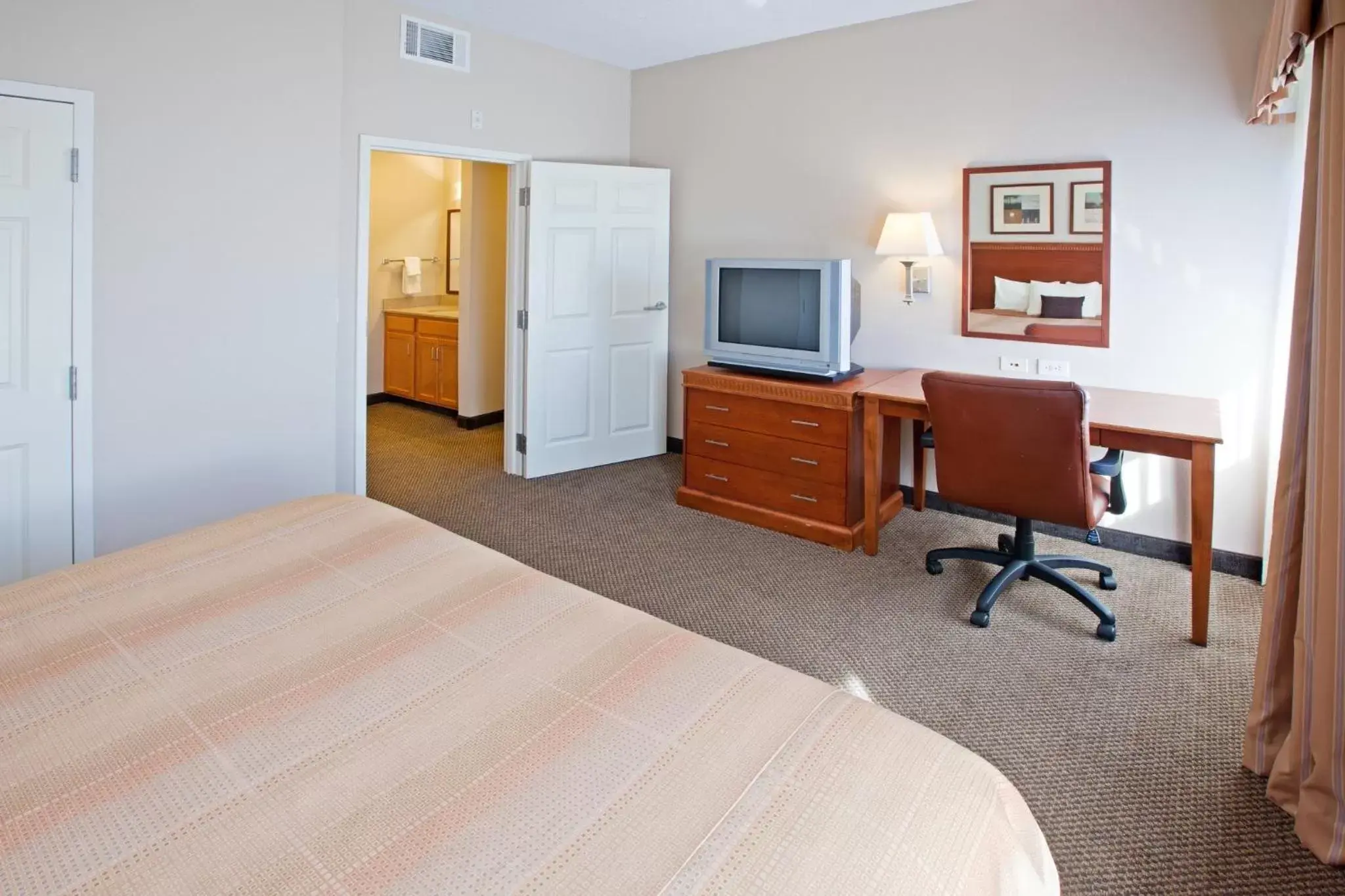 Photo of the whole room, TV/Entertainment Center in Candlewood Suites Indianapolis Downtown Medical District, an IHG Hotel