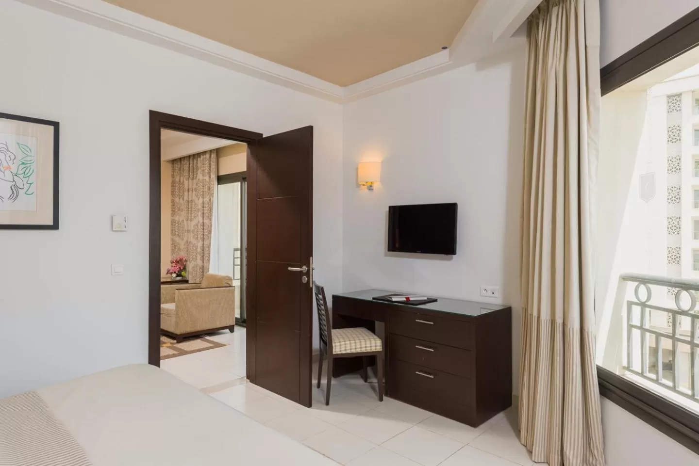 Bed in Le Corail Suites Hotel