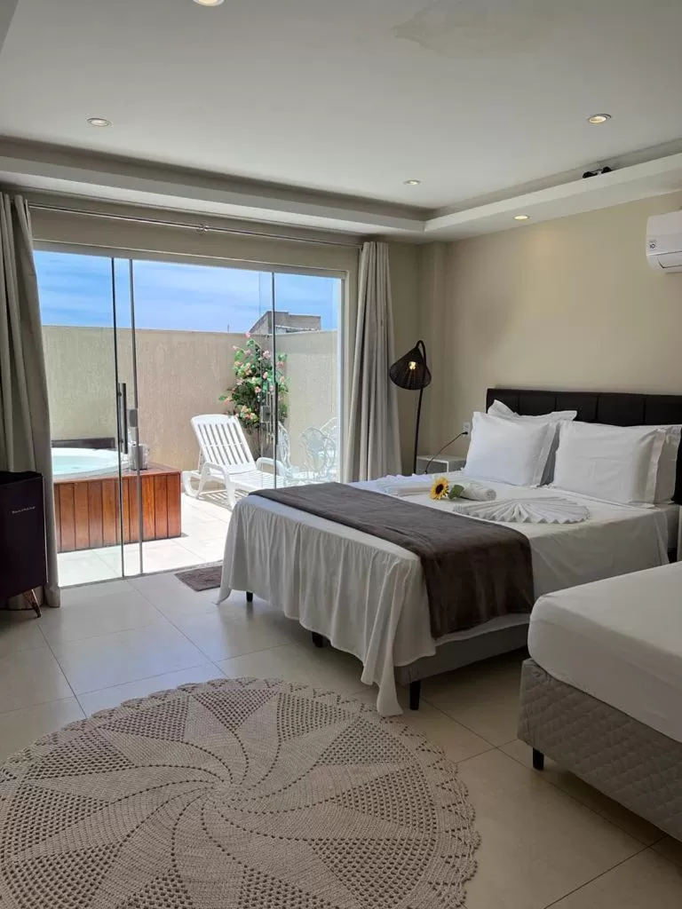 Bed in Pousada Arraial Tropical