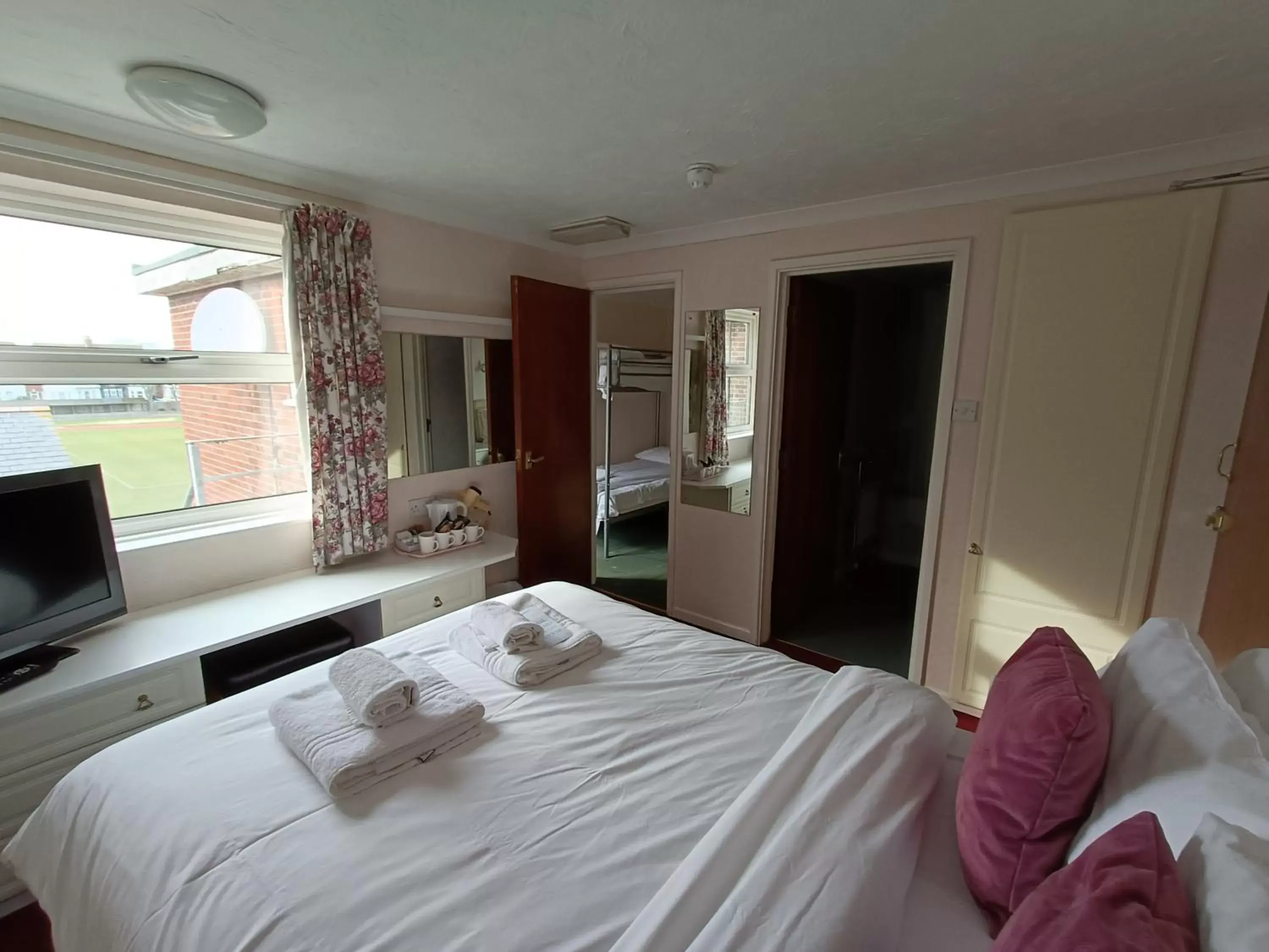 Bedroom in Palm Court Hotel