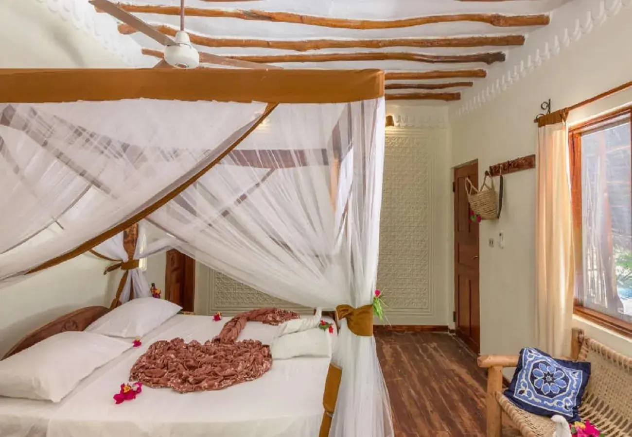Bedroom, Bed in Hakuna Majiwe Beach Lodge Zanzibar