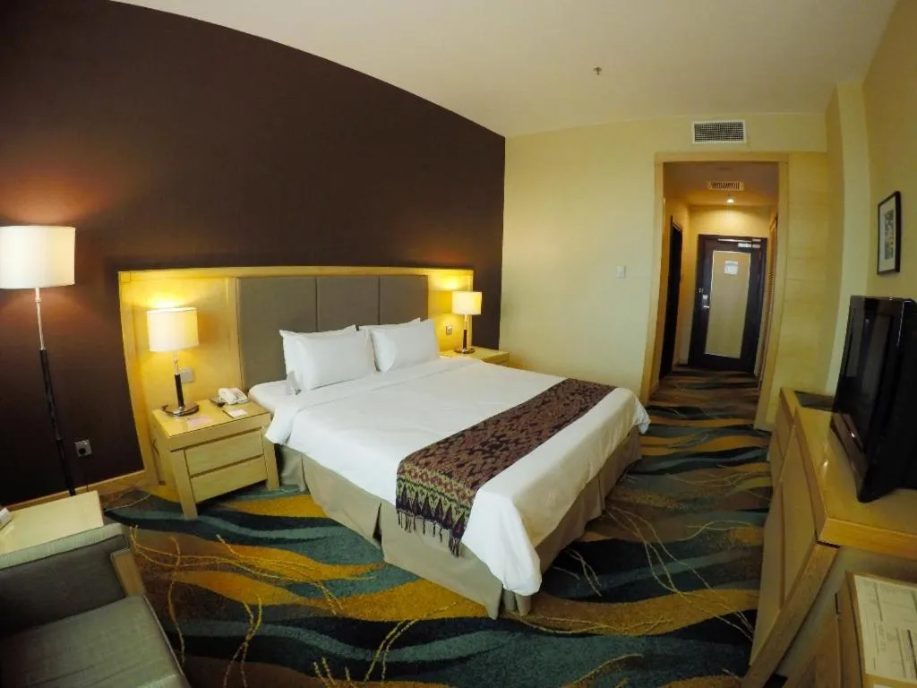 Bed in Imperial Palace Hotel