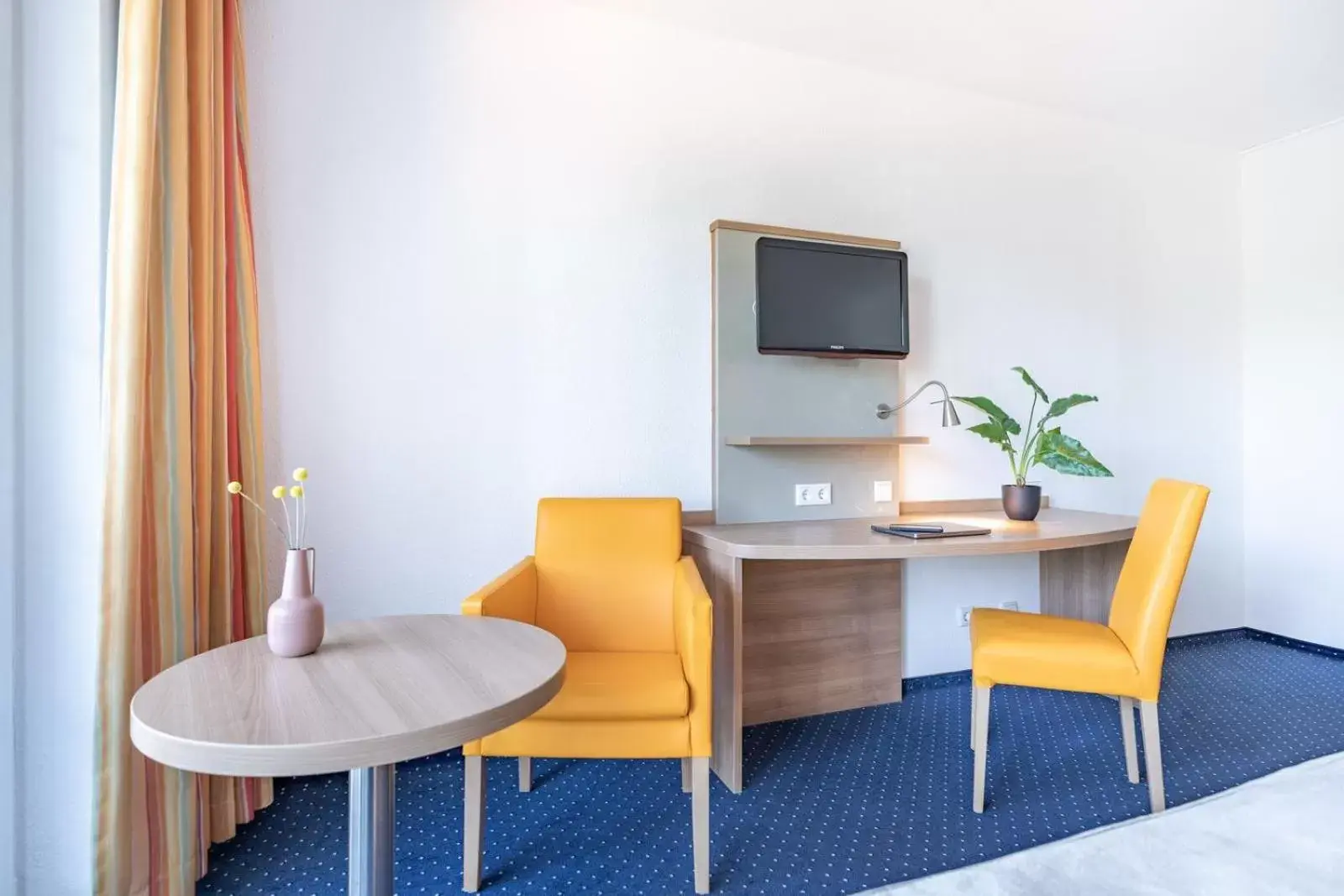 Living room in acora Düsseldorf Living the City - Apartments Living room in acora Düsseldorf Living the City - Apartments