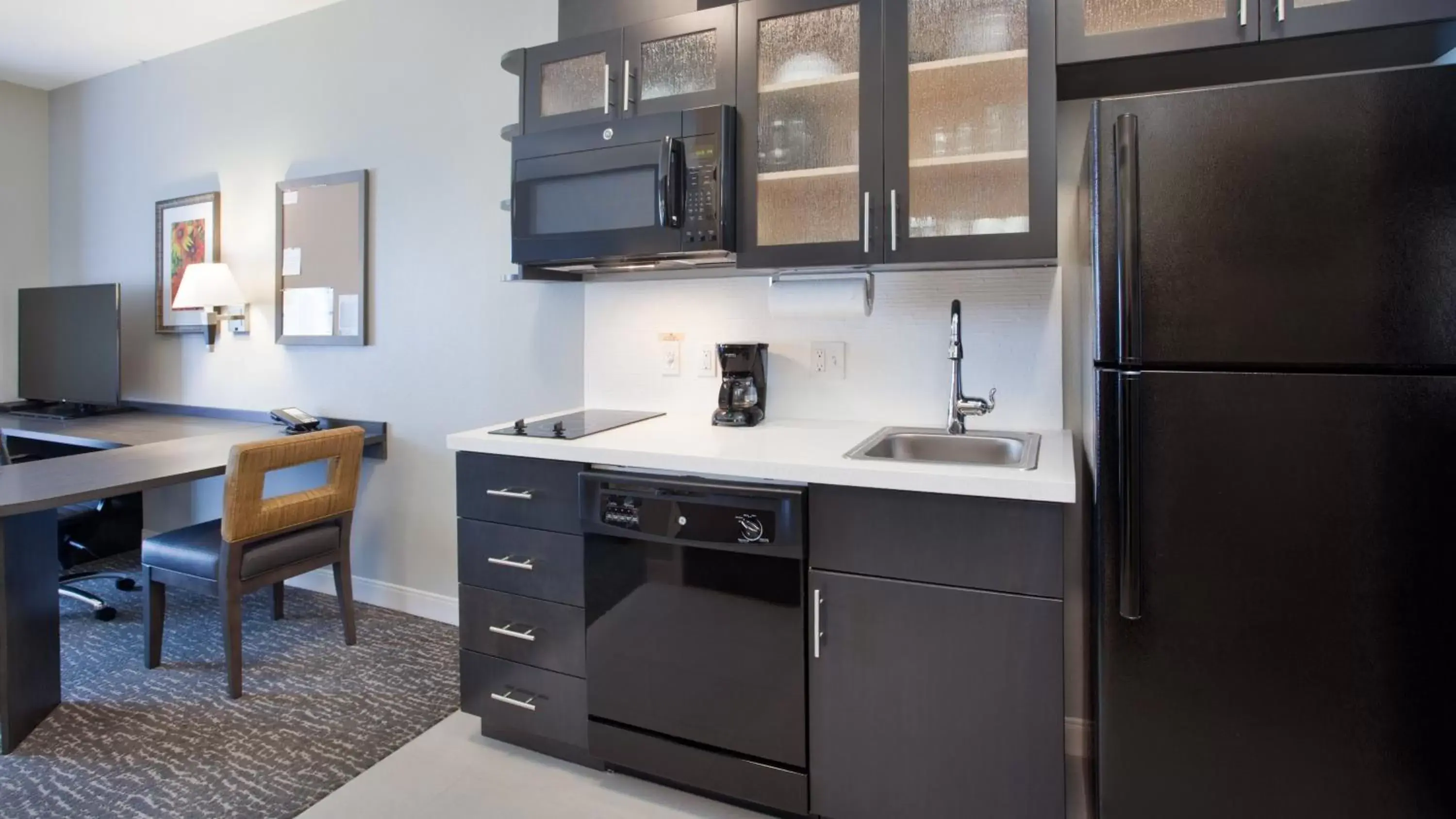 Photo of the whole room, Kitchen/Kitchenette in Candlewood Suites Grand Island, an IHG Hotel