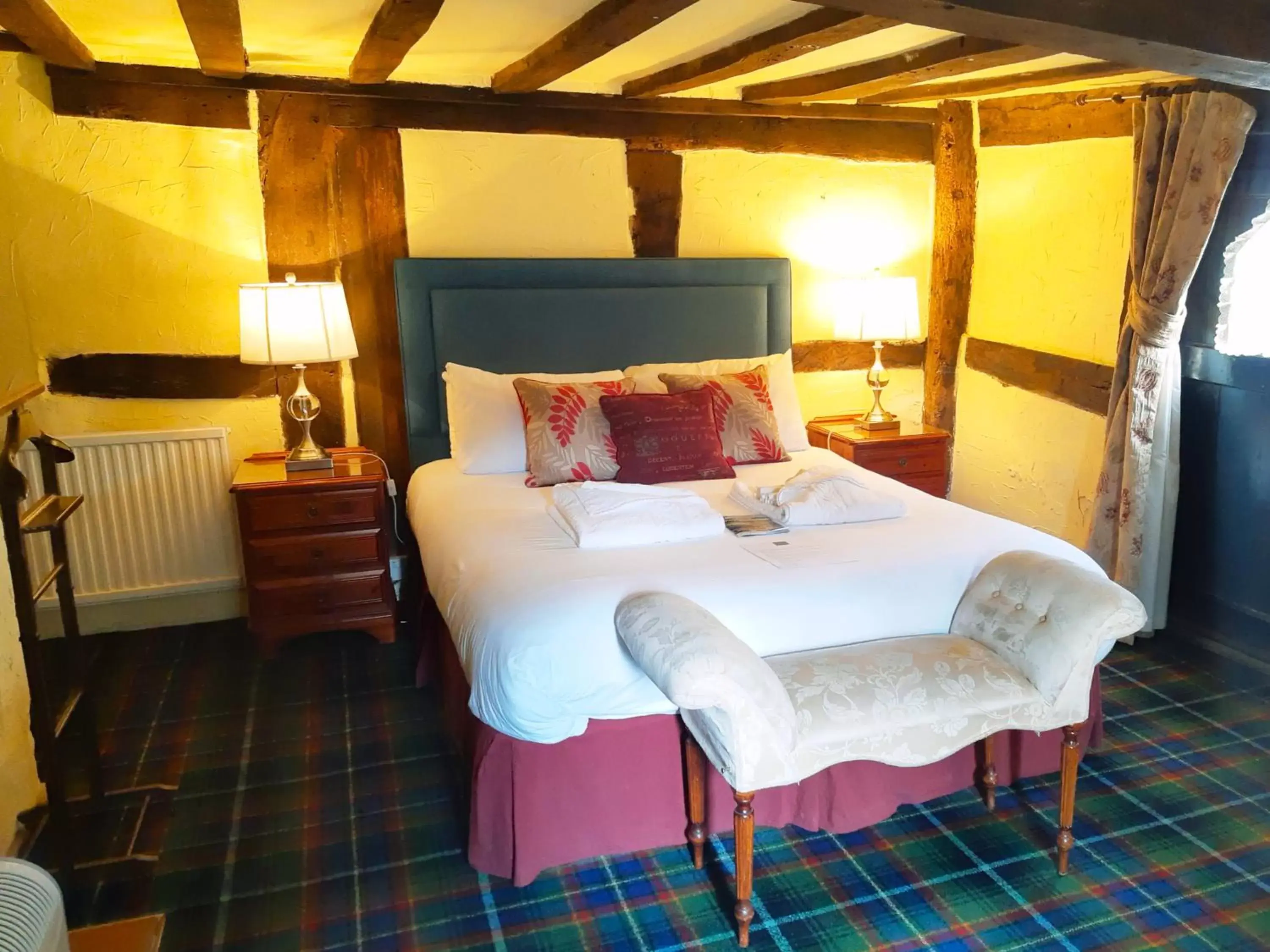 Bed in Thatched Cottage Hotel