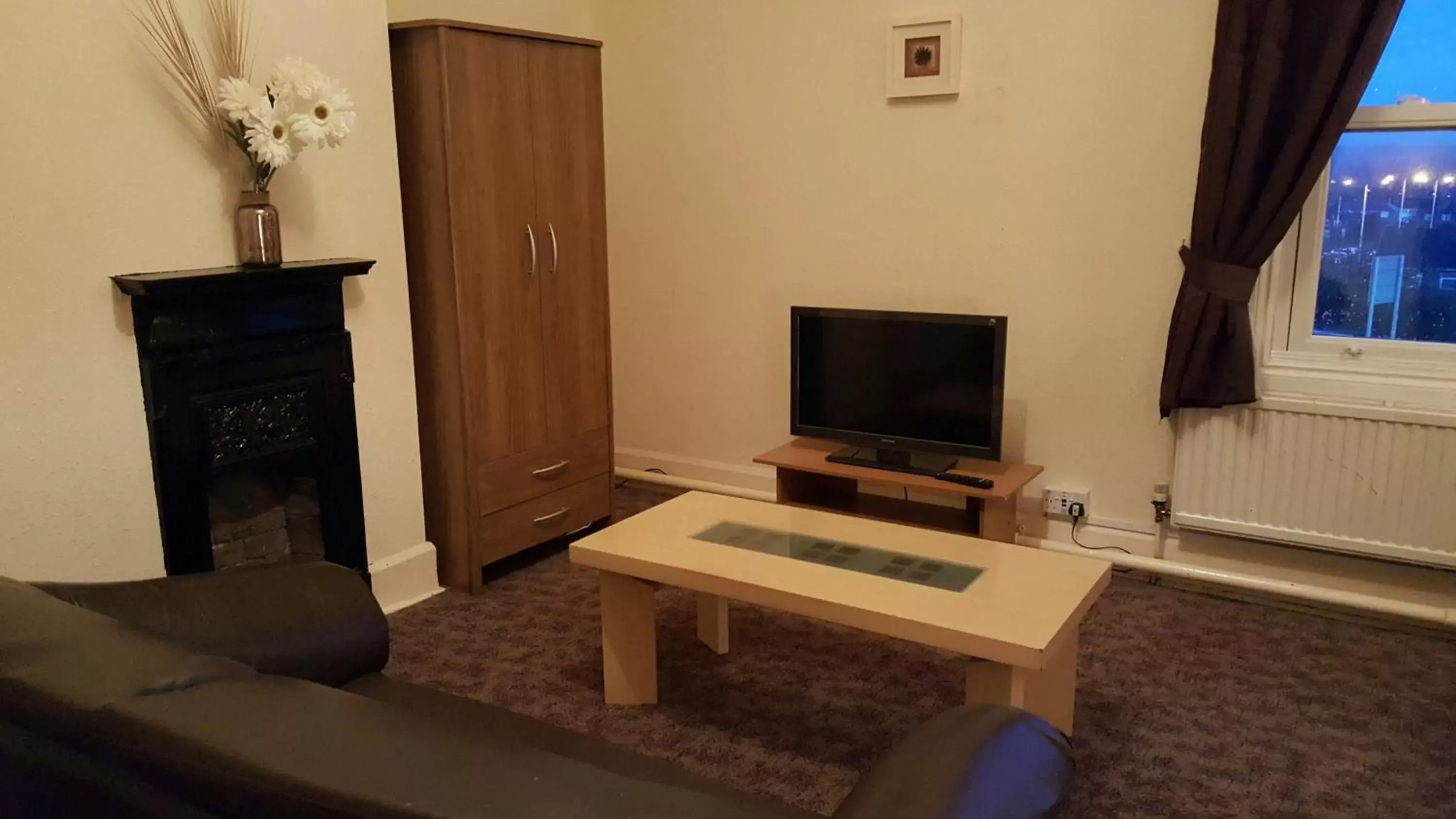 Photo of the whole room, TV/Entertainment Center in Station Hotel