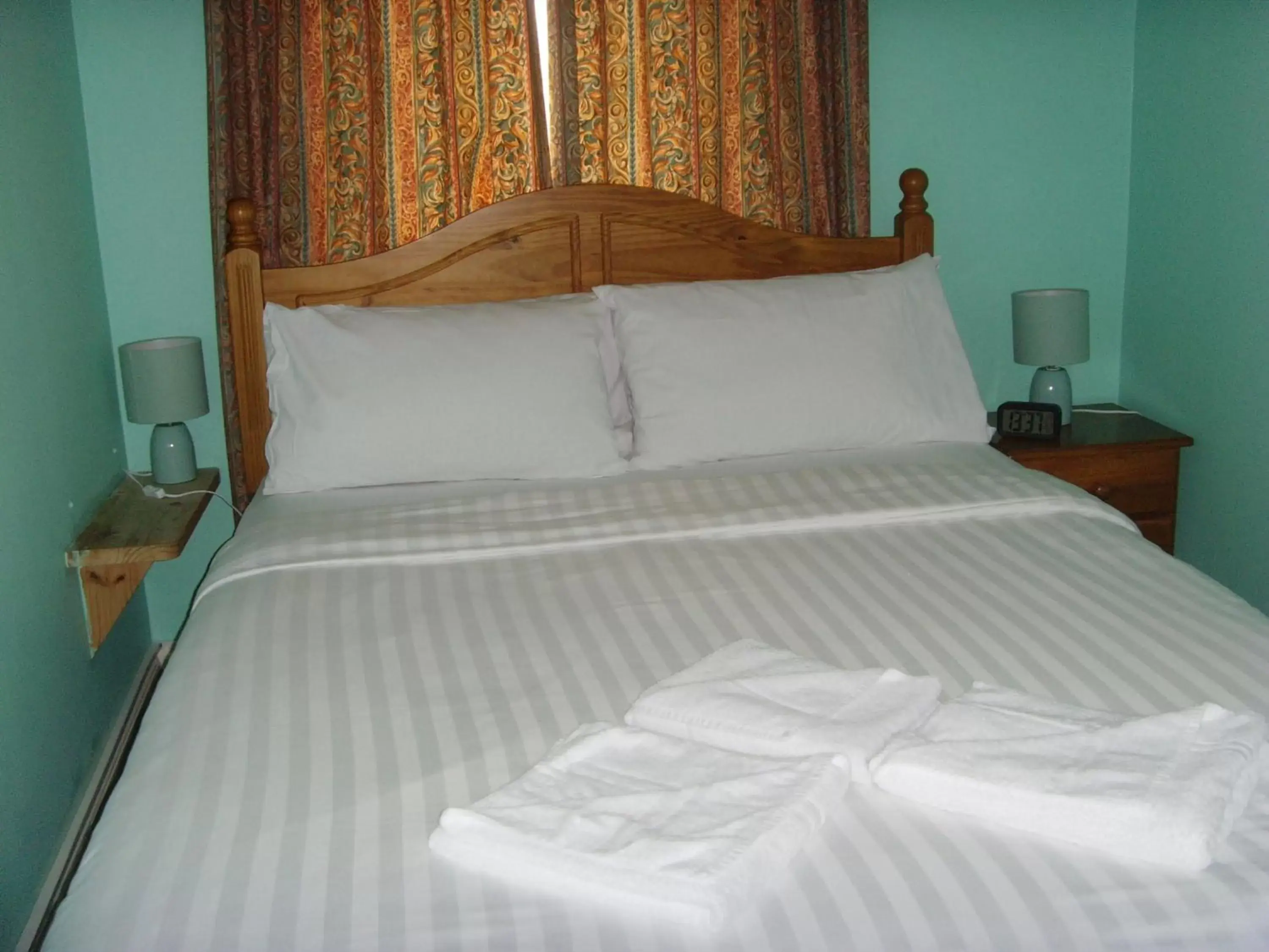 Bed in Twin Lions Hotel