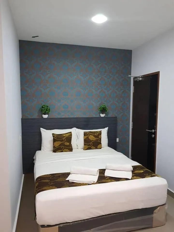 Bed in D'Metro Hotel