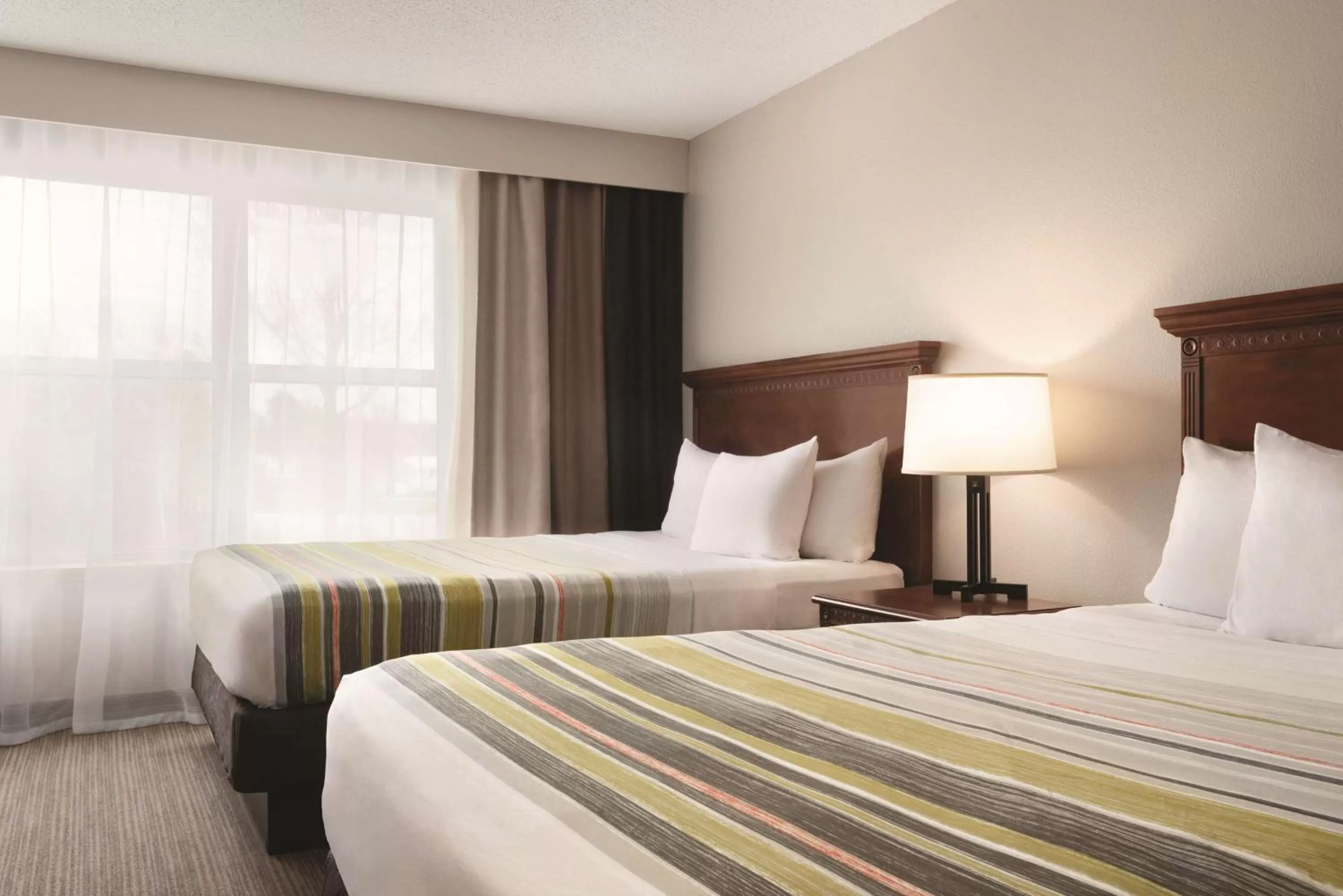 Property building in Country Inn & Suites by Radisson, Marinette, WI