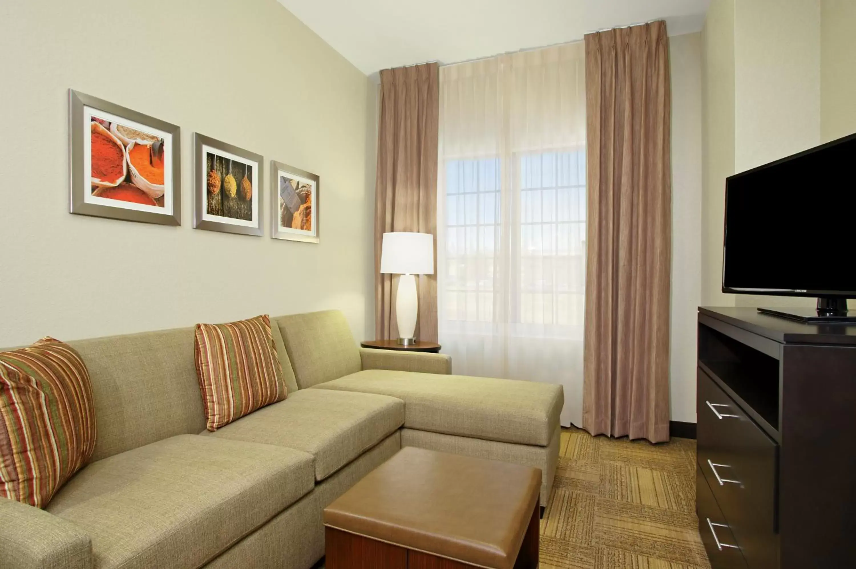 Bedroom, Seating Area in Staybridge Suites - Odessa - Interstate HWY 20, an IHG Hotel