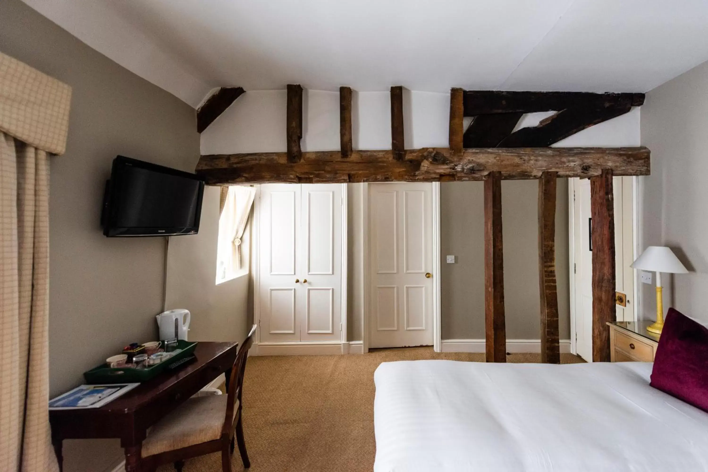 Bedroom, TV/Entertainment Center in The Whipper-In Hotel