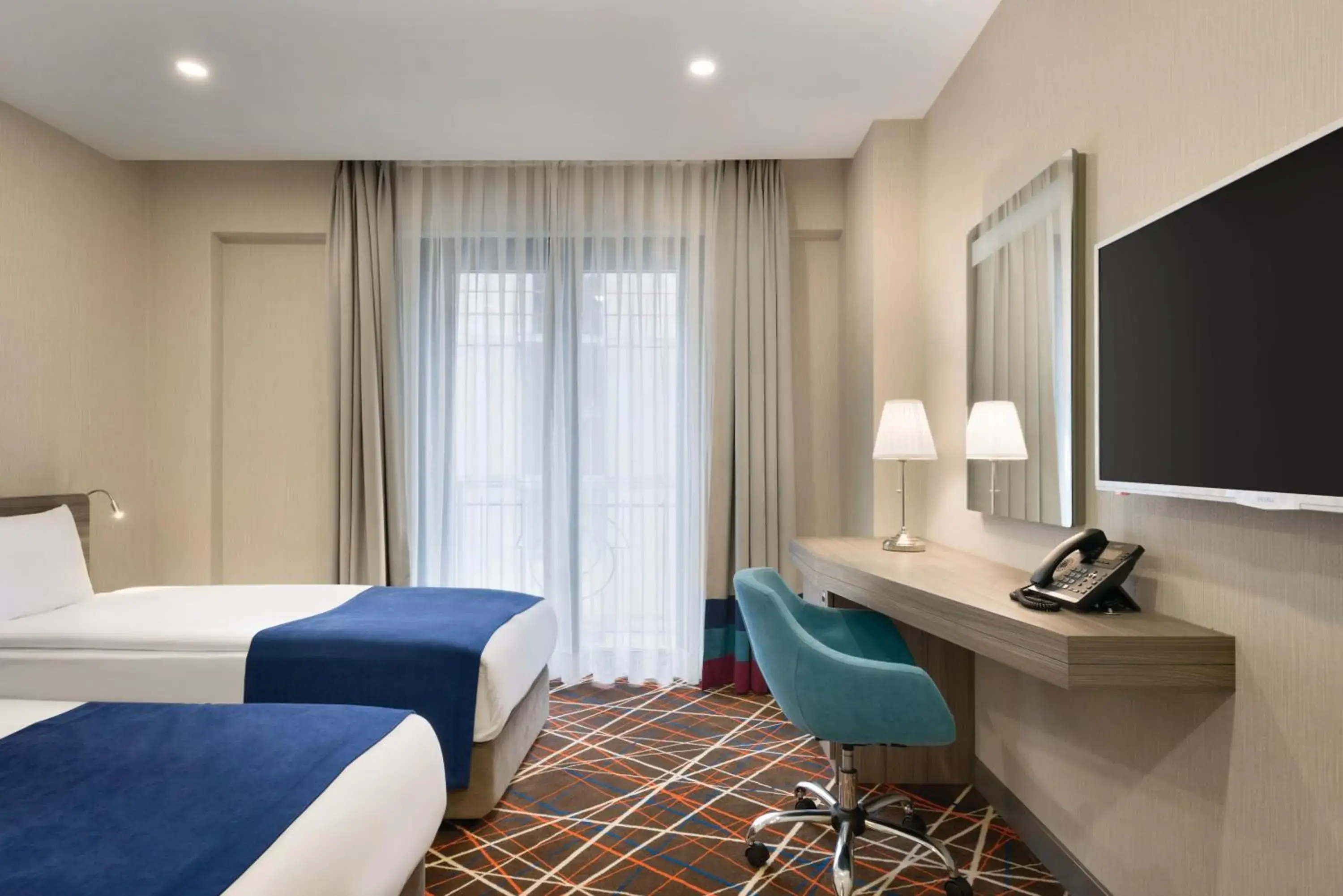 Photo of the whole room in Tryp by Wyndham Istanbul Taksim