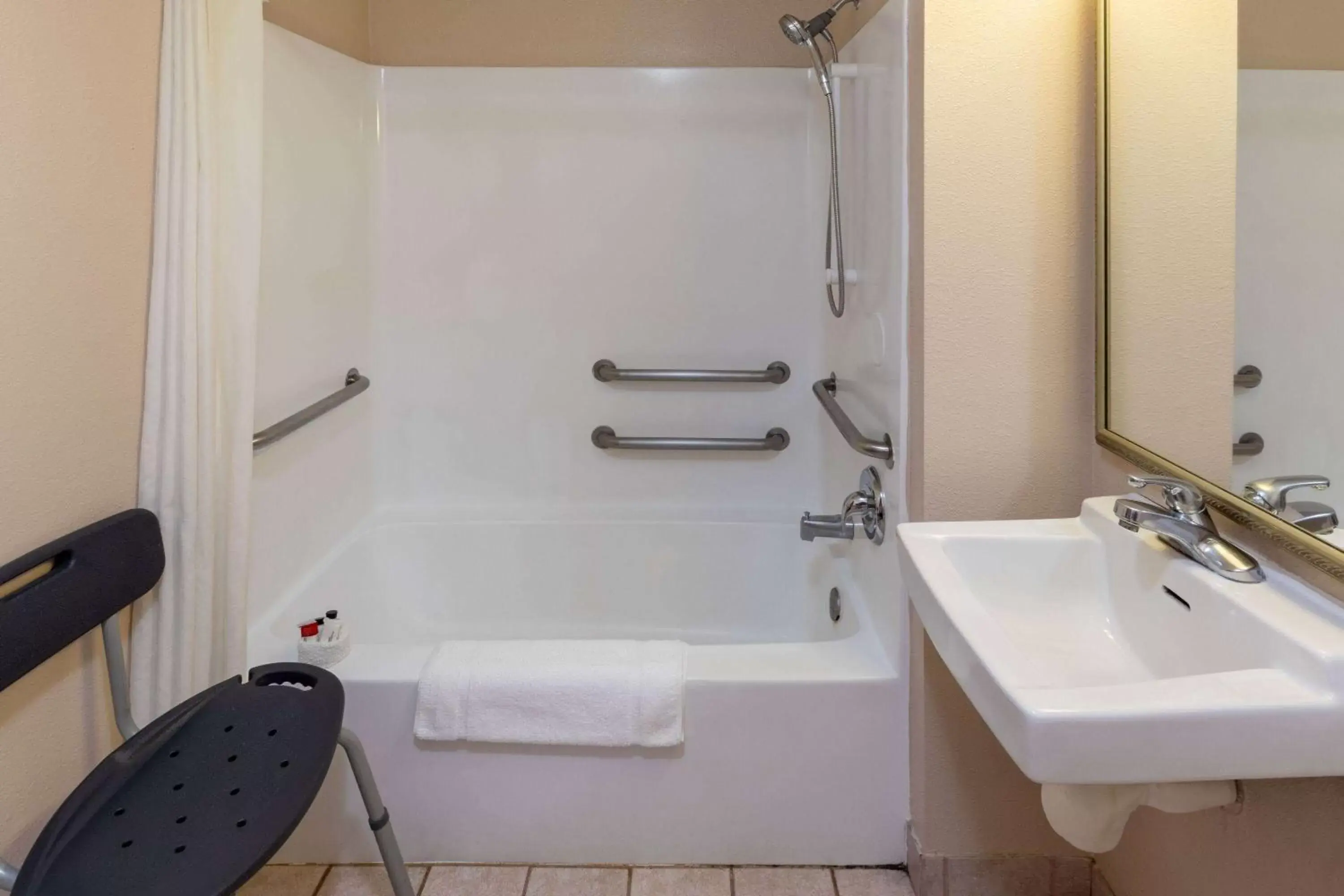 Bathroom in Super 8 by Wyndham Garland/Rowlett/East Dallas area