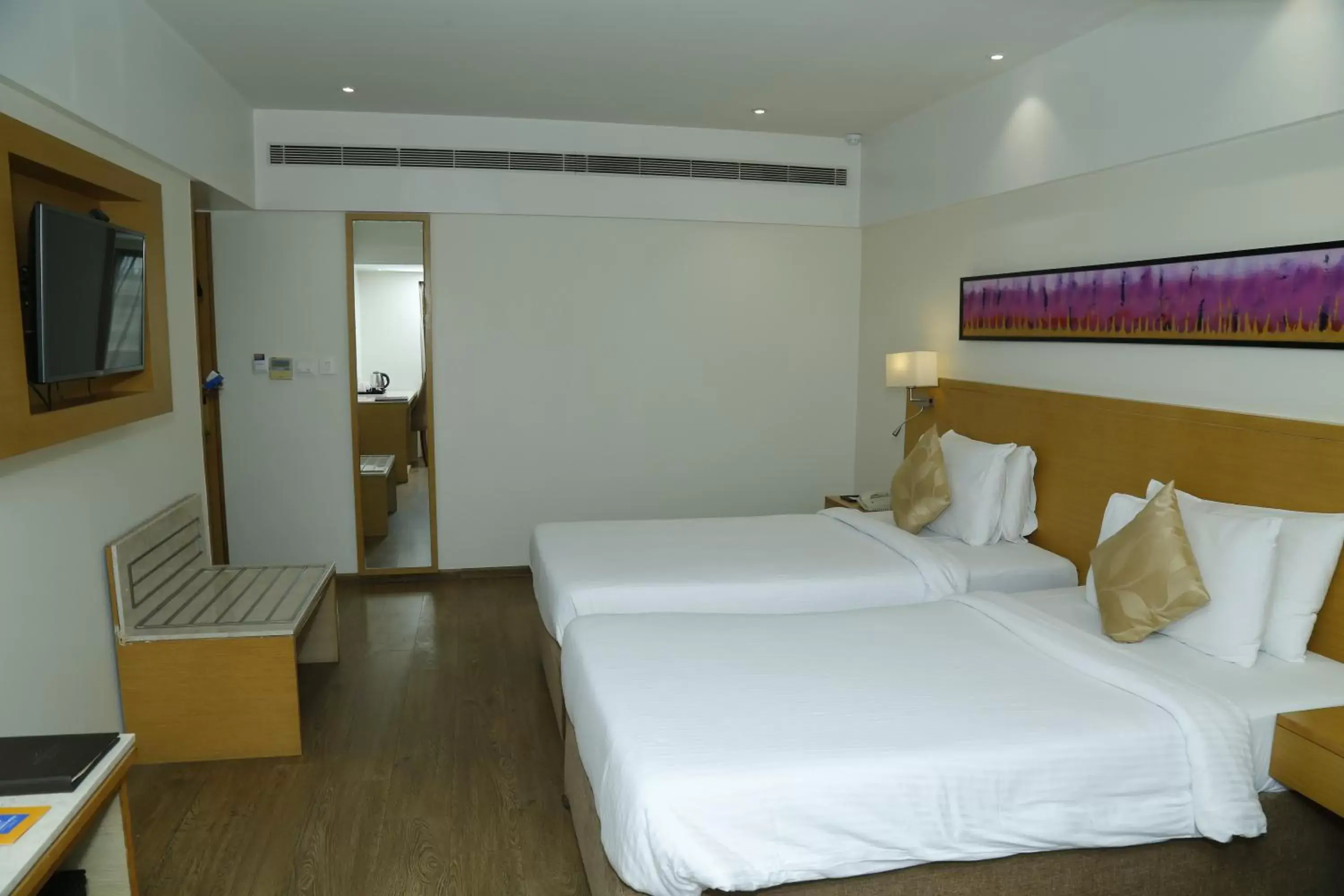 Bed in Sarovar Portico Rivera Ahmedabad