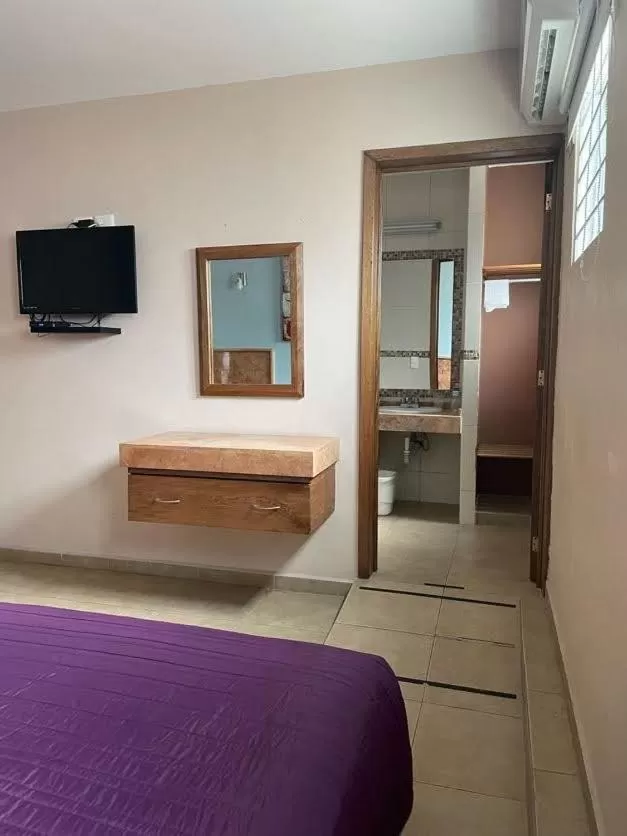 Bed in Hotel Santo Domingo Express