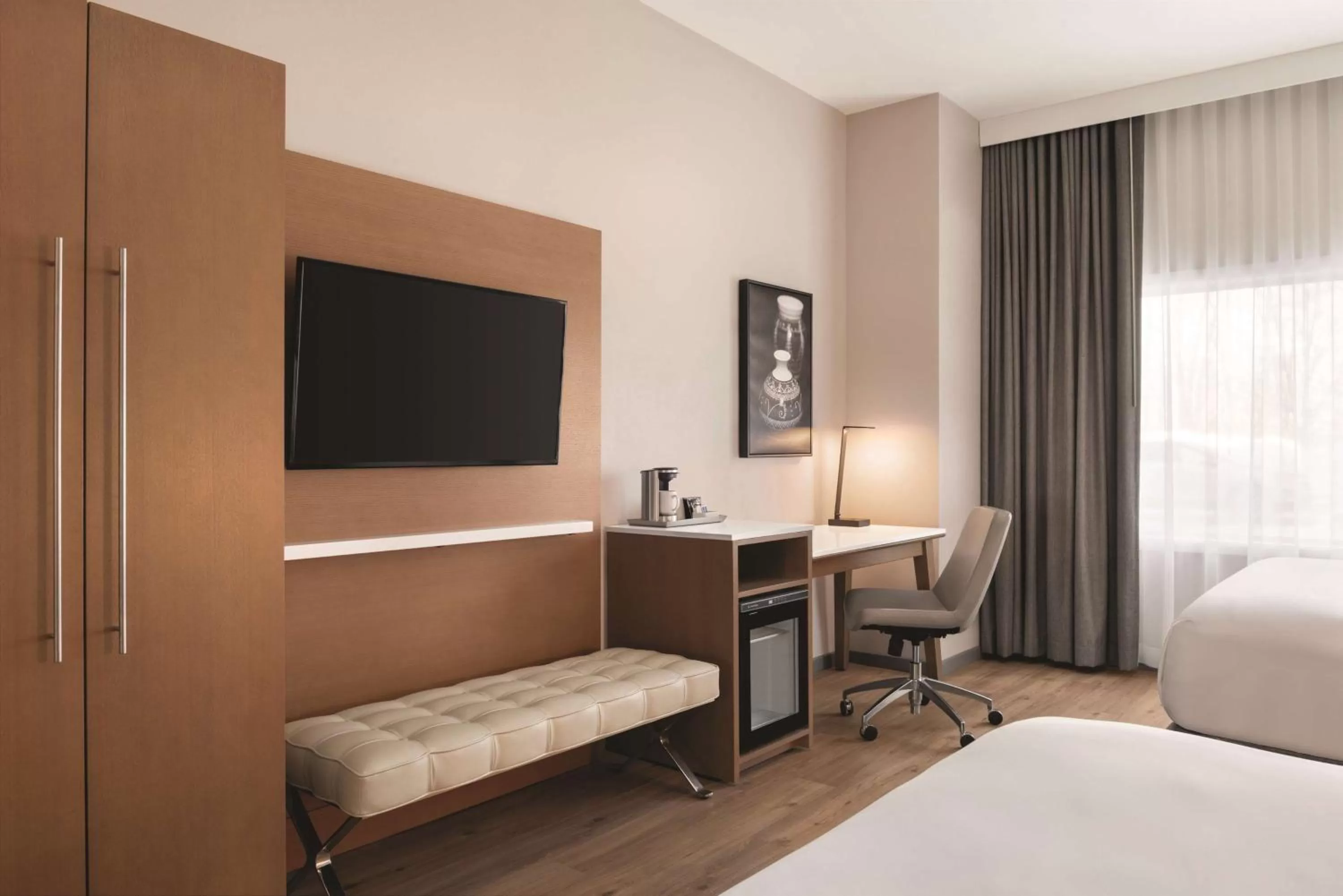 Photo of the whole room, TV/Entertainment Center in Radisson Hotel & Conference Center Green Bay