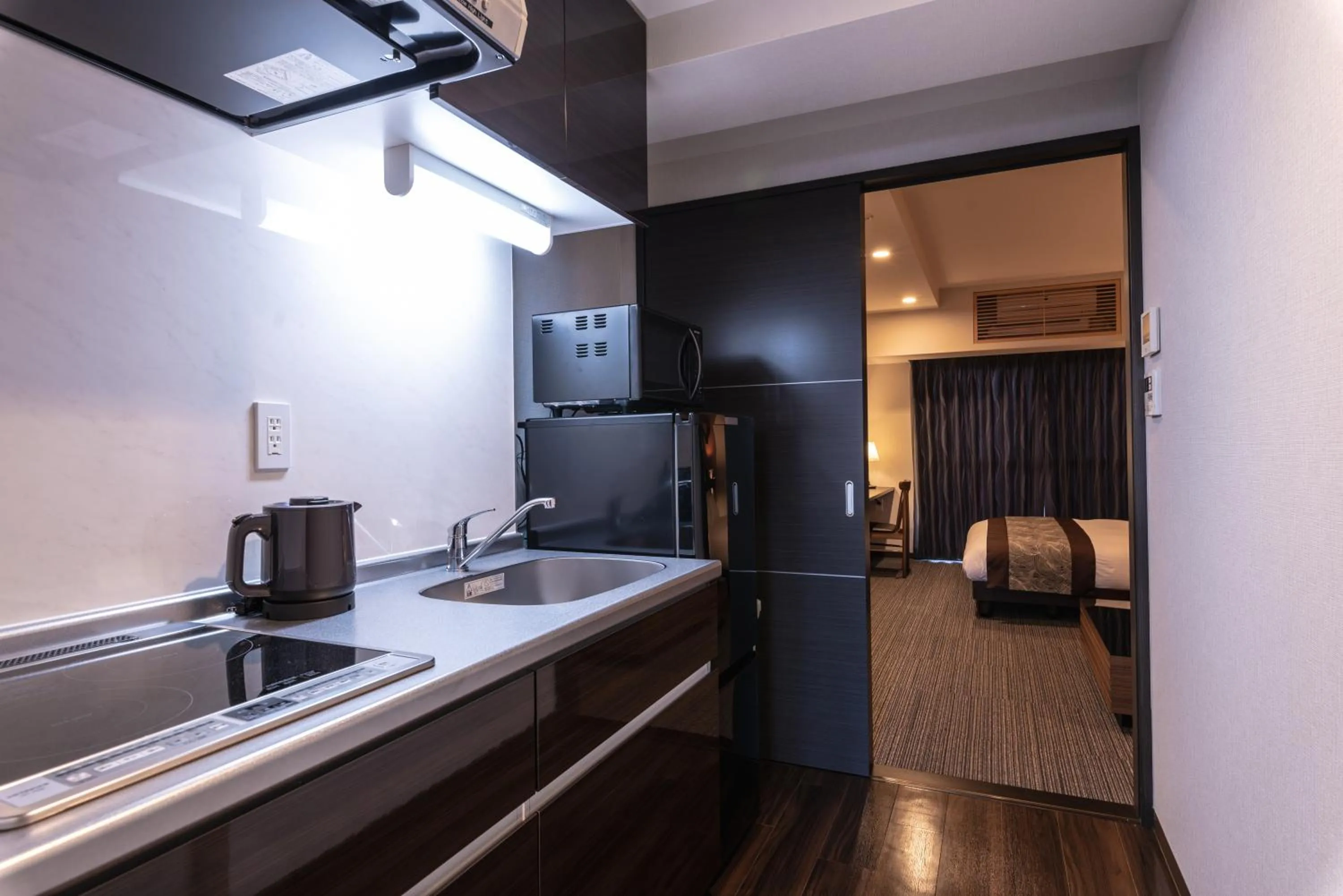 Kitchen or kitchenette in Zen Kyoto Apartment Hotel