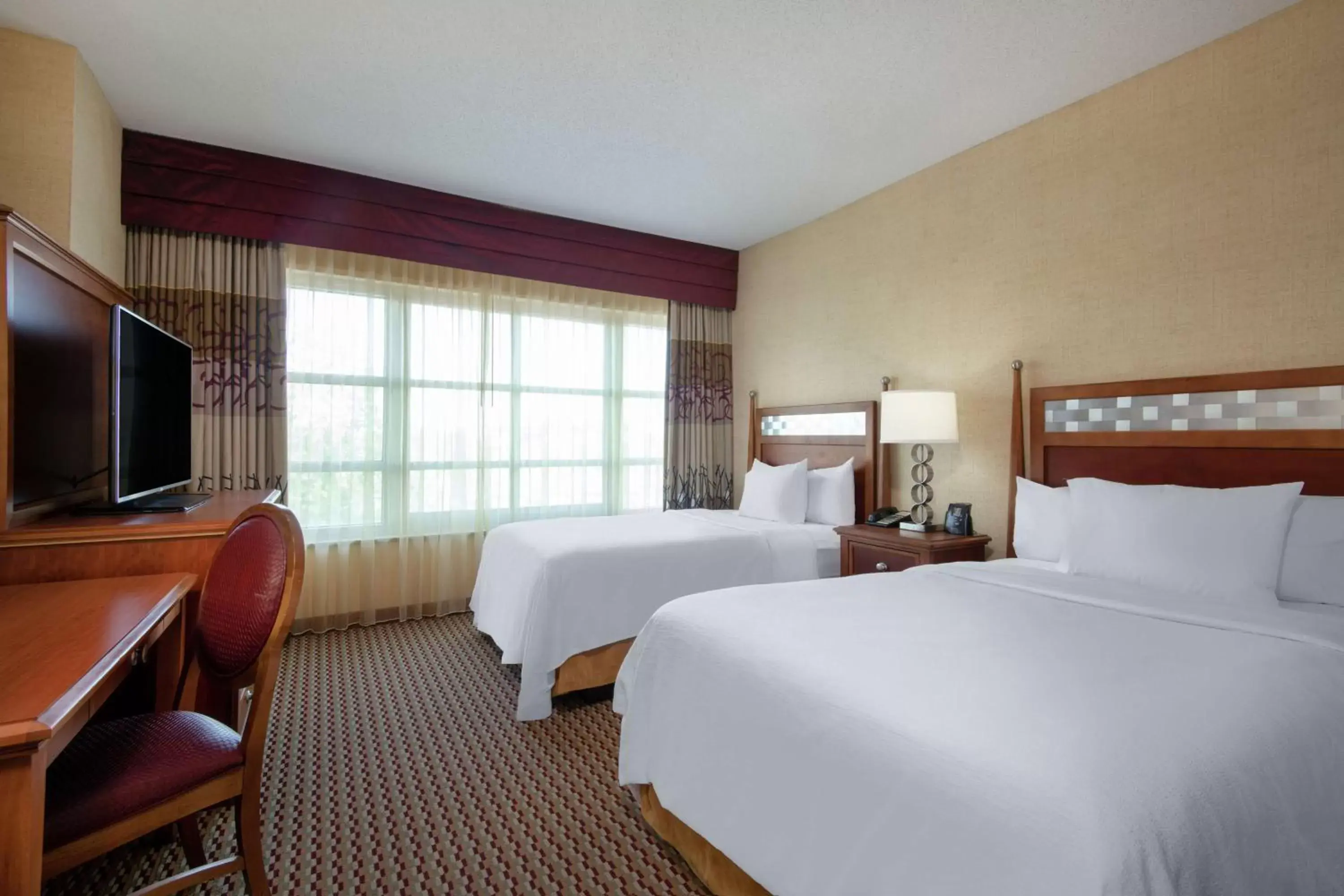 Bedroom in Embassy Suites Northwest Arkansas - Hotel, Spa & Convention Center