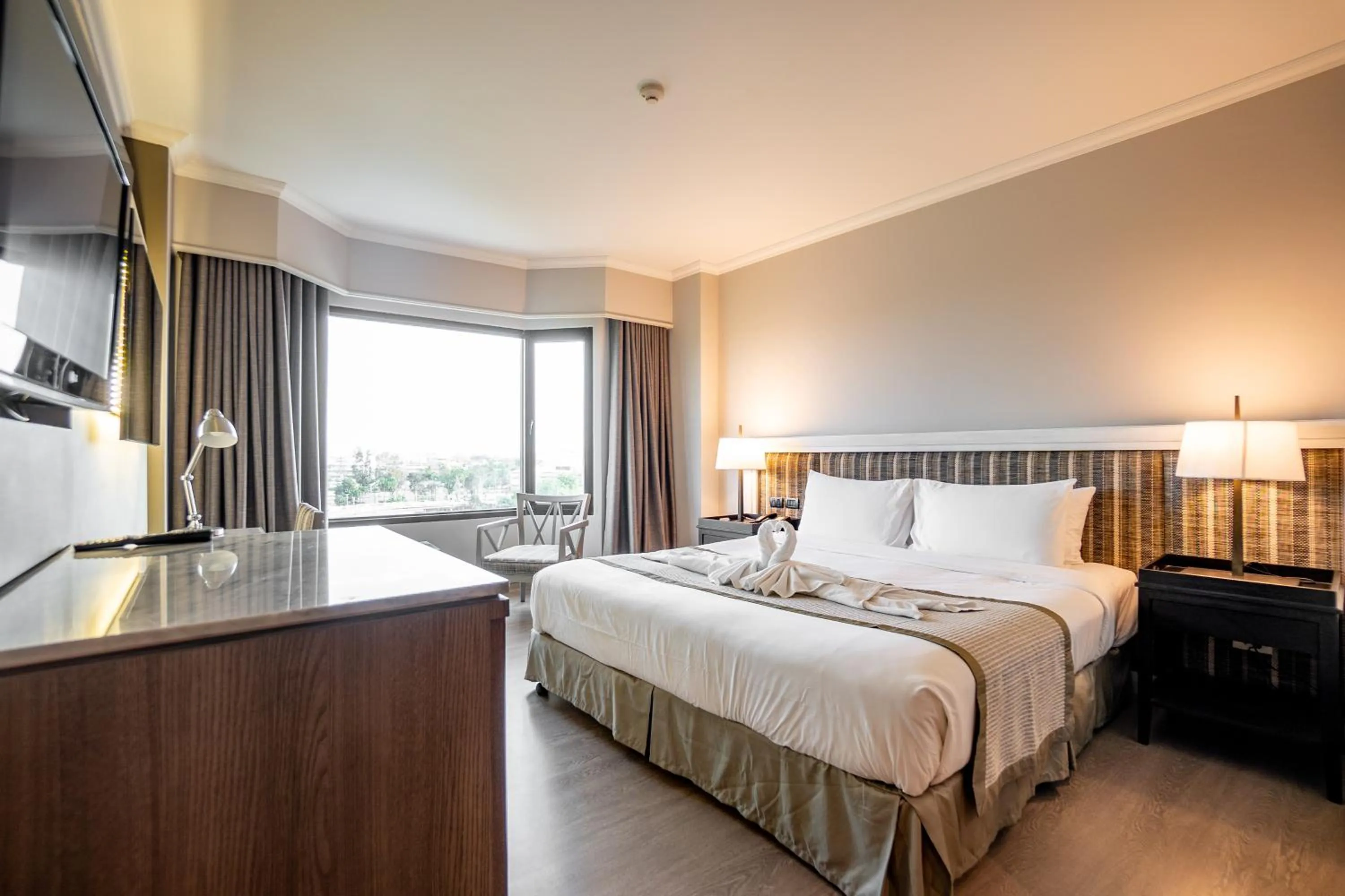 Bed in The Grand Riverside Hotel