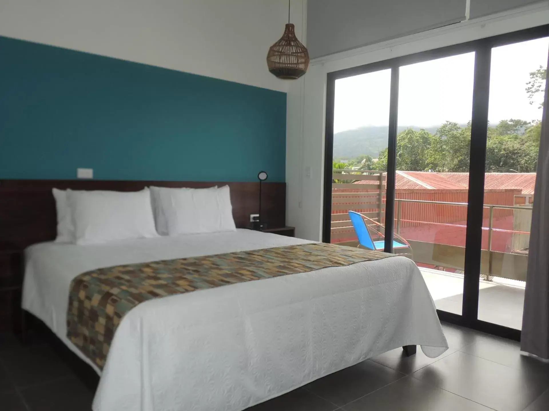 Bedroom, Bed in La Fortuna Lodge by Treebu Hotels