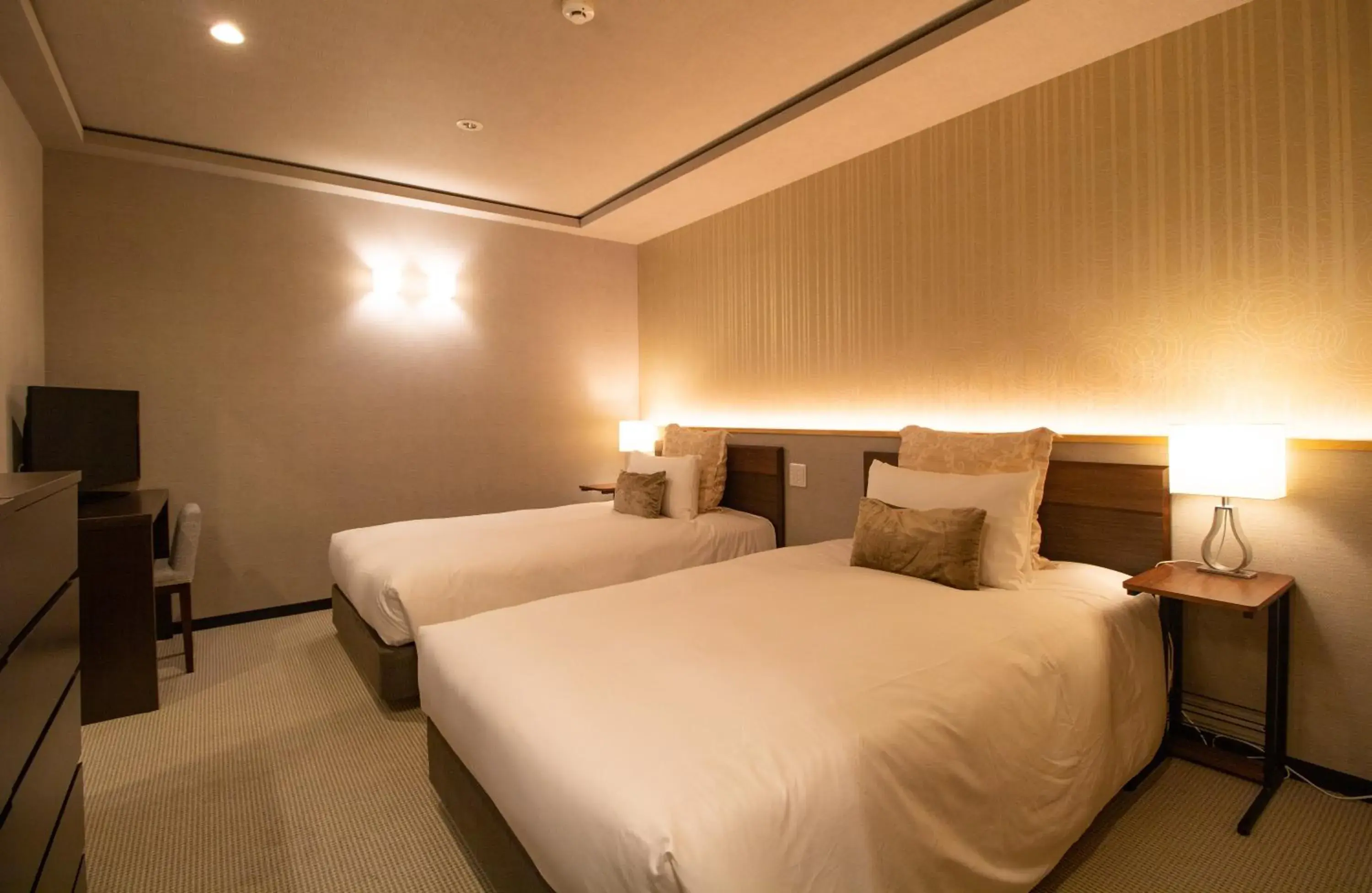 Bed in R&Run Kyoto Serviced Apartment & Suites