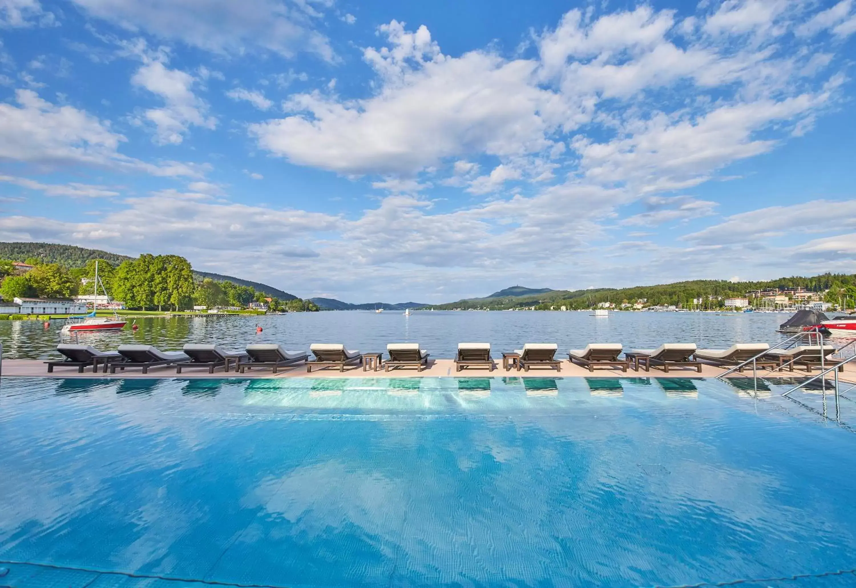 Natural landscape, Swimming Pool in Falkensteiner Schlosshotel Velden – The Leading Hotels of the World