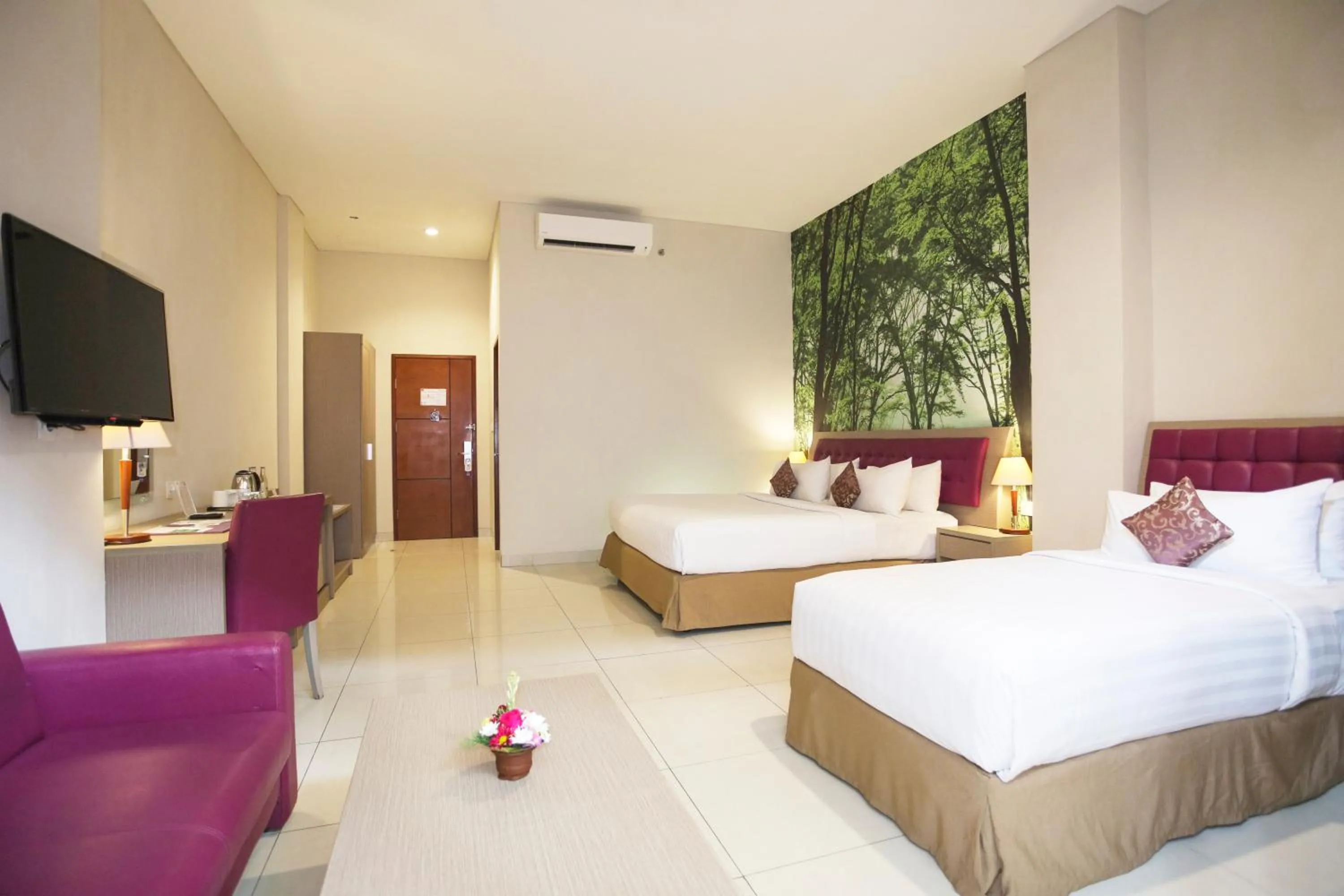 Bed in Kuta Central Park Hotel