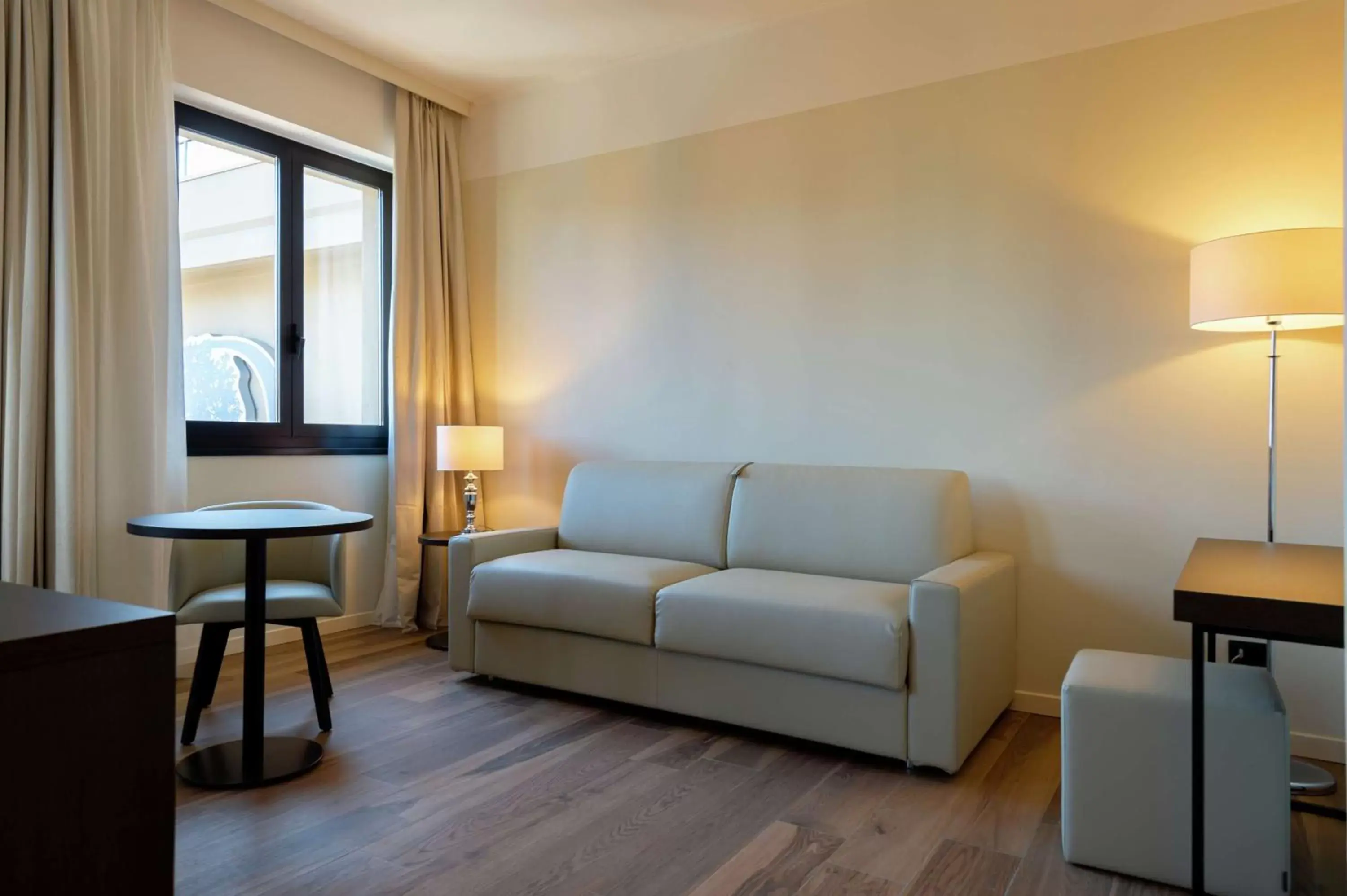 Bed, Seating Area in DoubleTree by Hilton Brescia