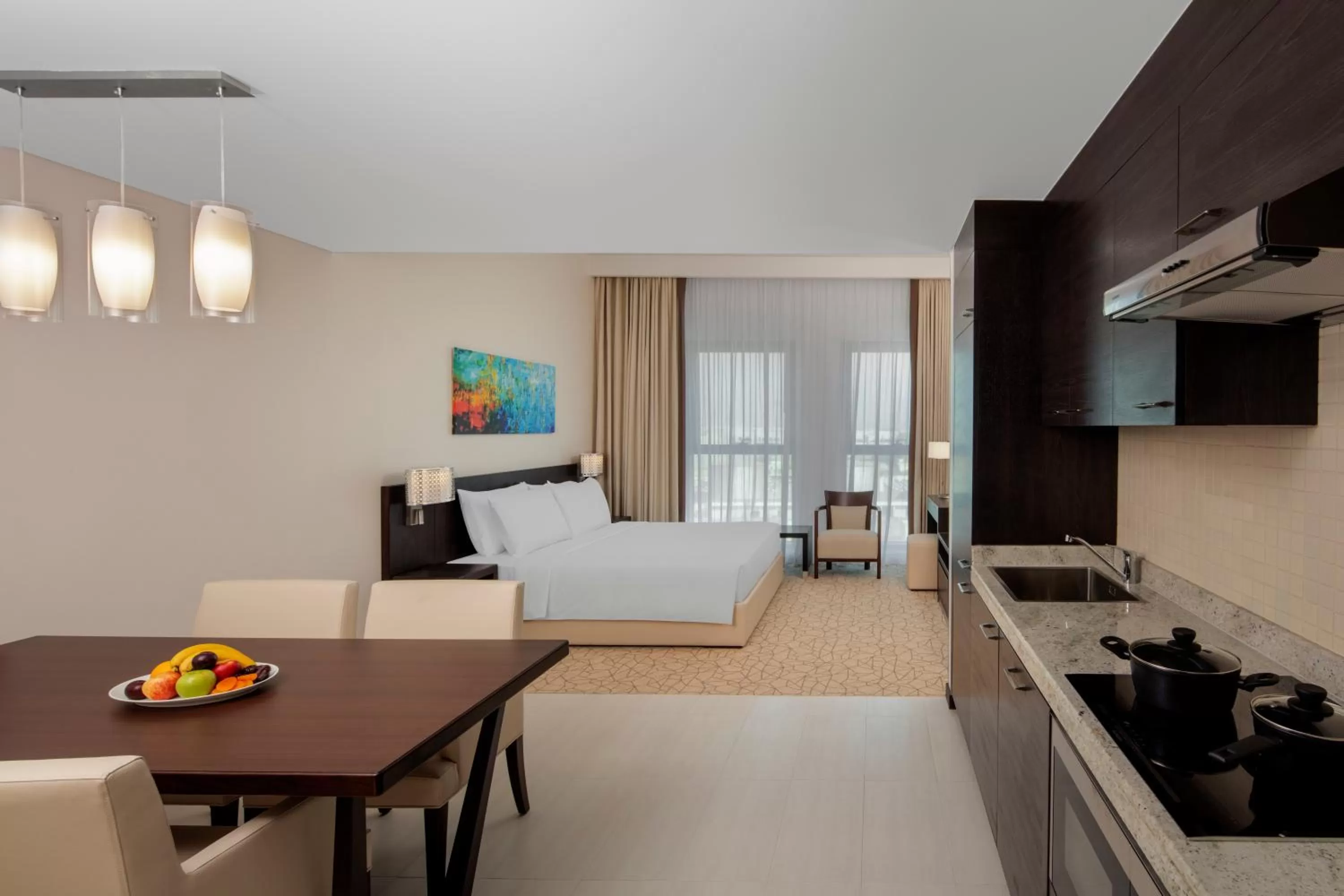 Bed, Kitchen/Kitchenette in Hyatt Place Dubai Al Rigga Residences