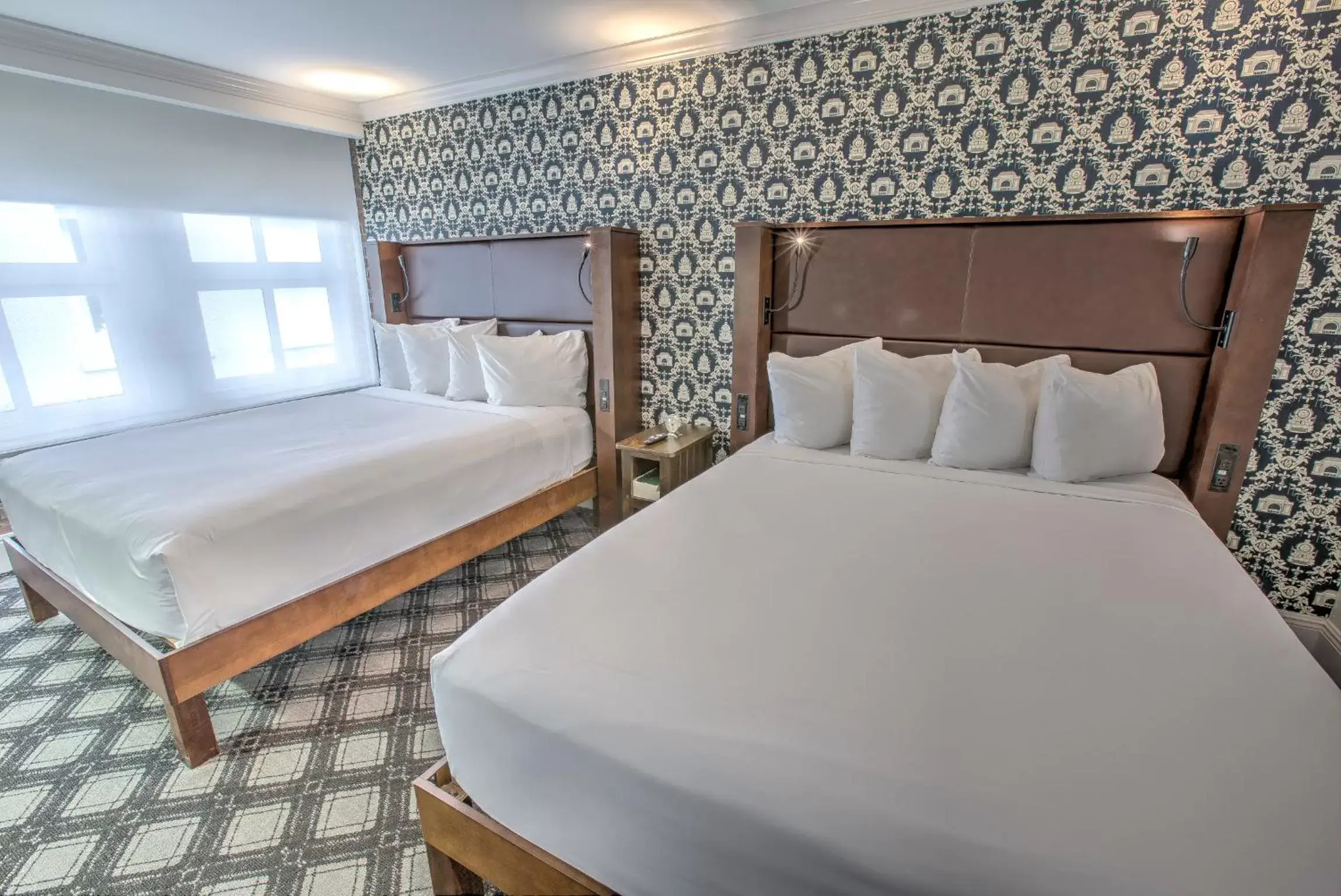 Bed in Q&C Hotel and Bar New Orleans, Autograph Collection Bed in Q&C Hotel and Bar New Orleans, Autograph Collection