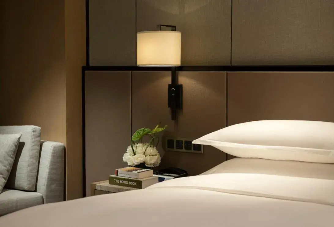 Bed in InterContinental Wuhan, an IHG Hotel