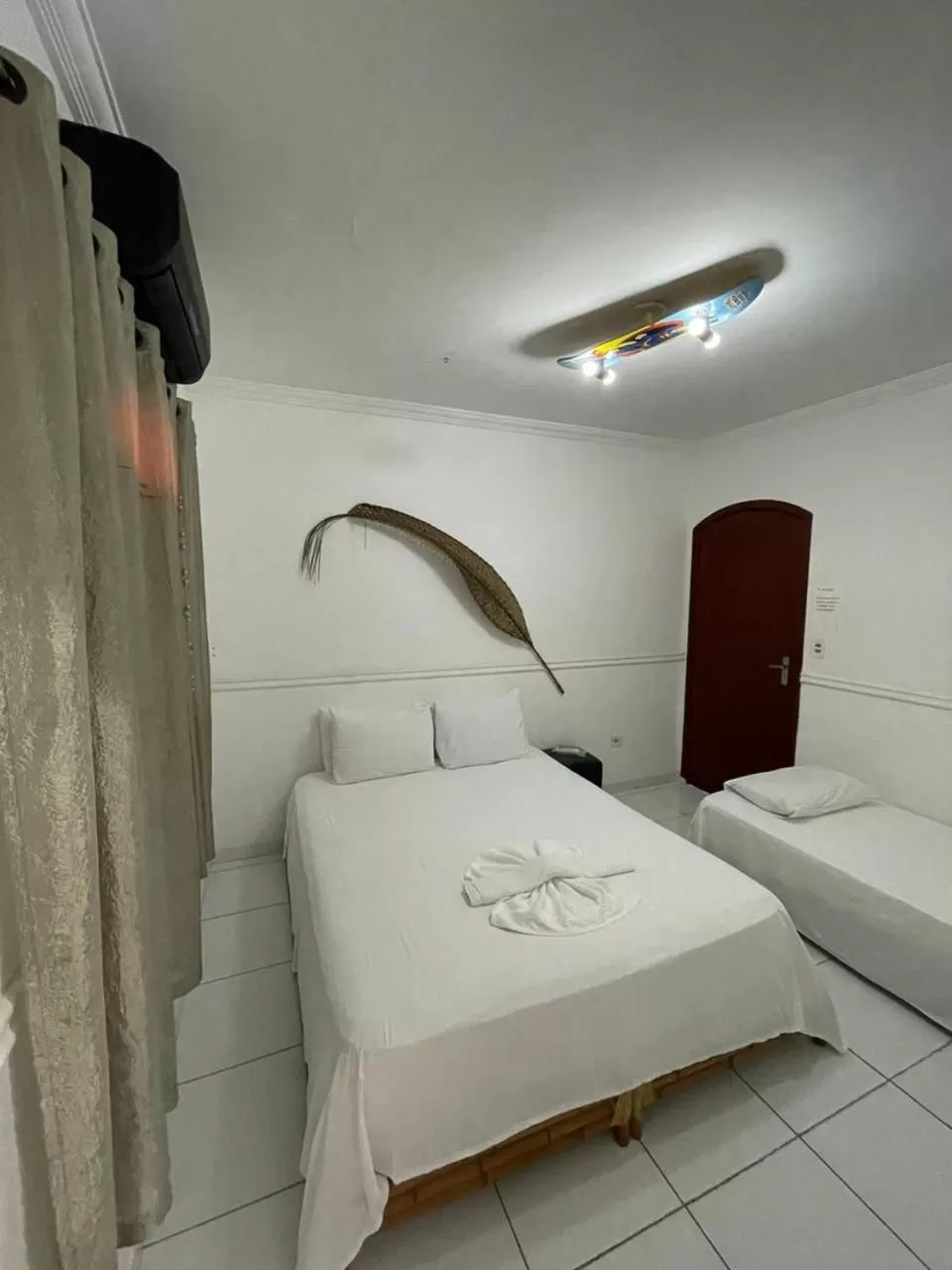 Bed in Pousada Praia do Tombo