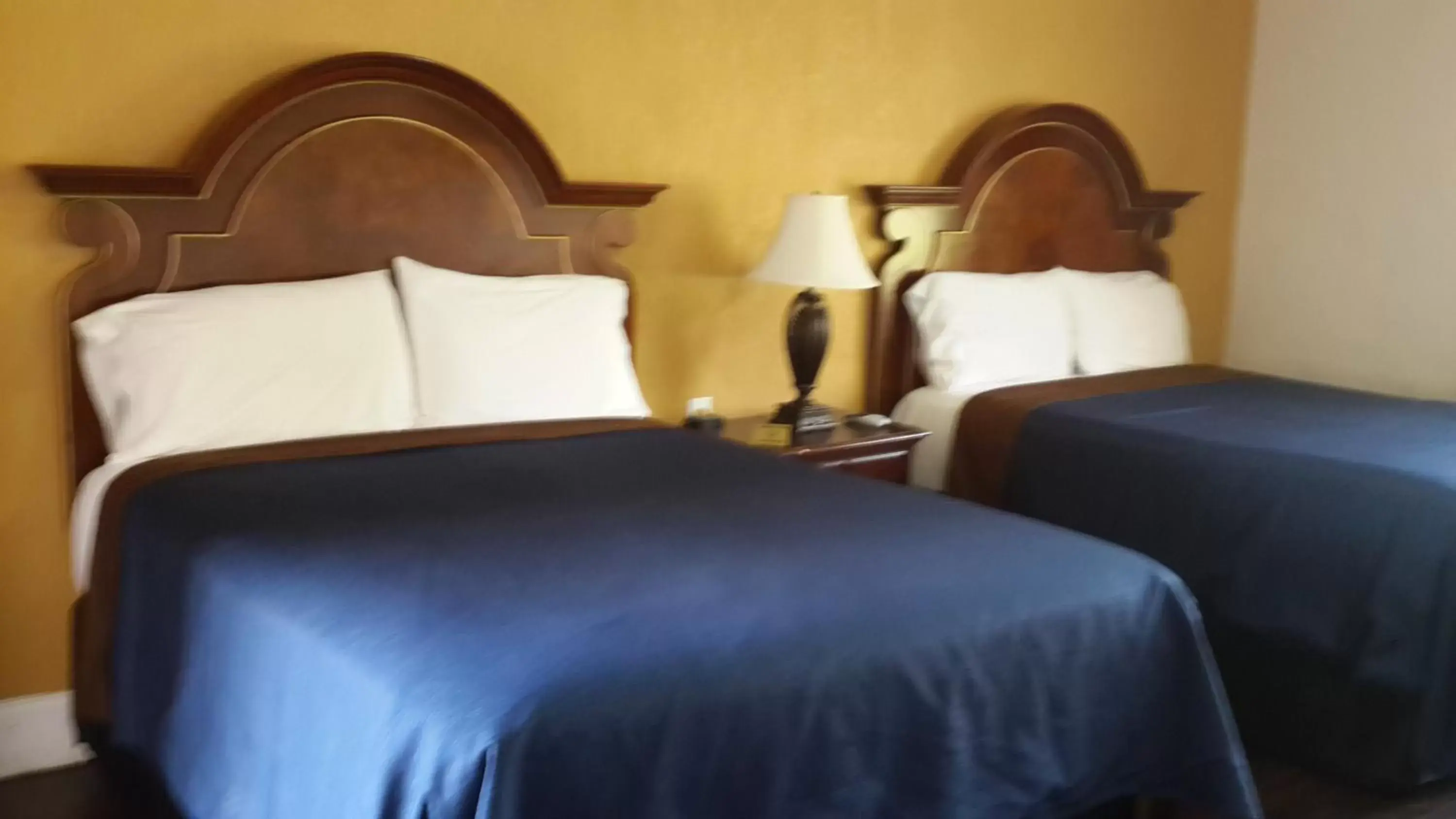 Bed in American Regency Inn
