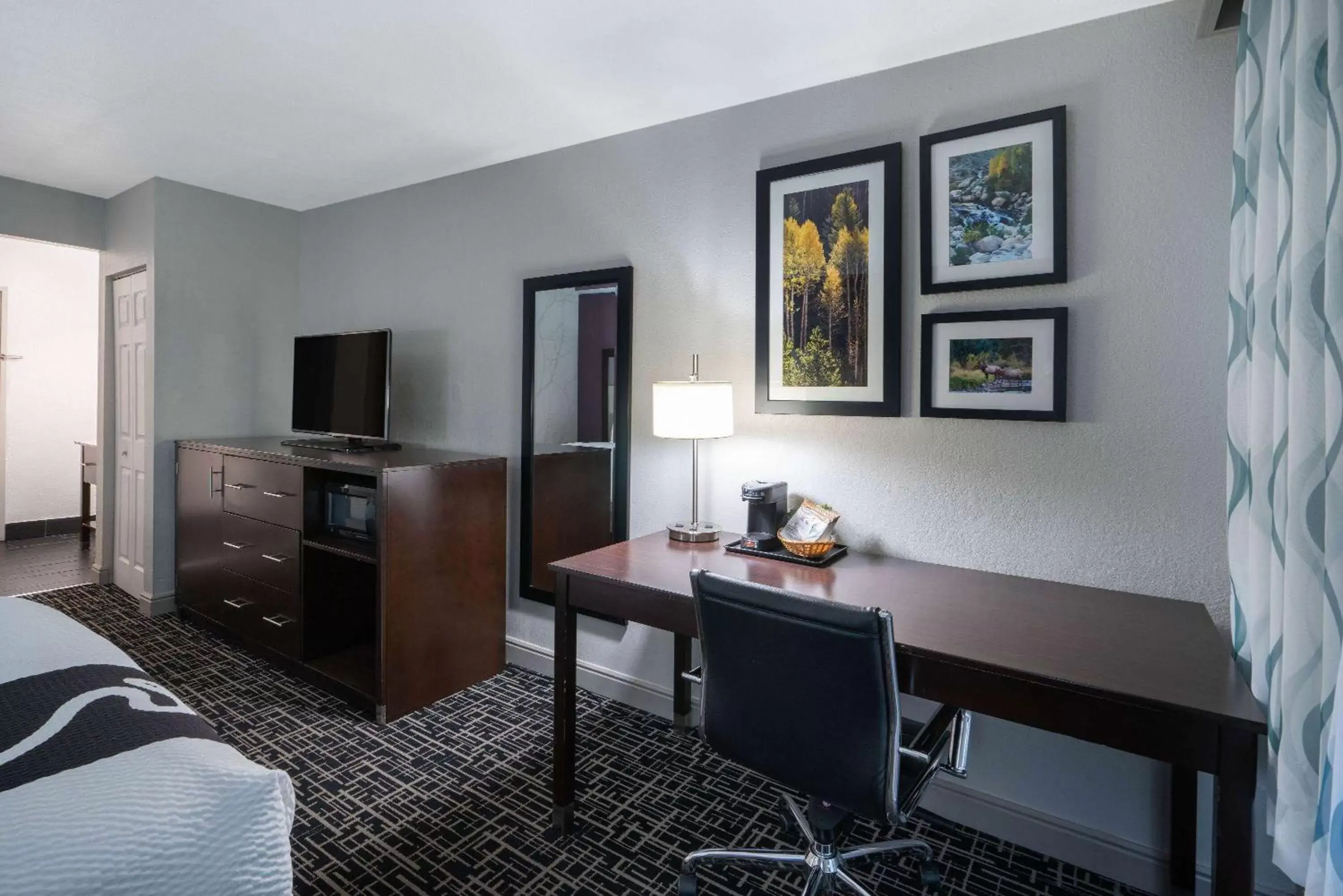 Photo of the whole room, TV/Entertainment Center in La Quinta Inn & Suites by Wyndham Fort Collins, Colorado