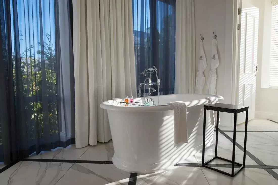 Bathroom in The Manor House at the Queen Victoria Hotel by NEWMARK