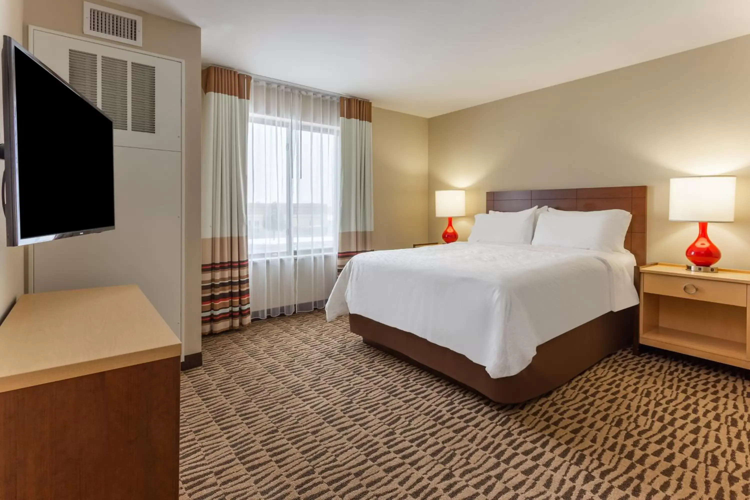 Bed in Candlewood Suites Fargo South-Medical Center, an IHG Hotel