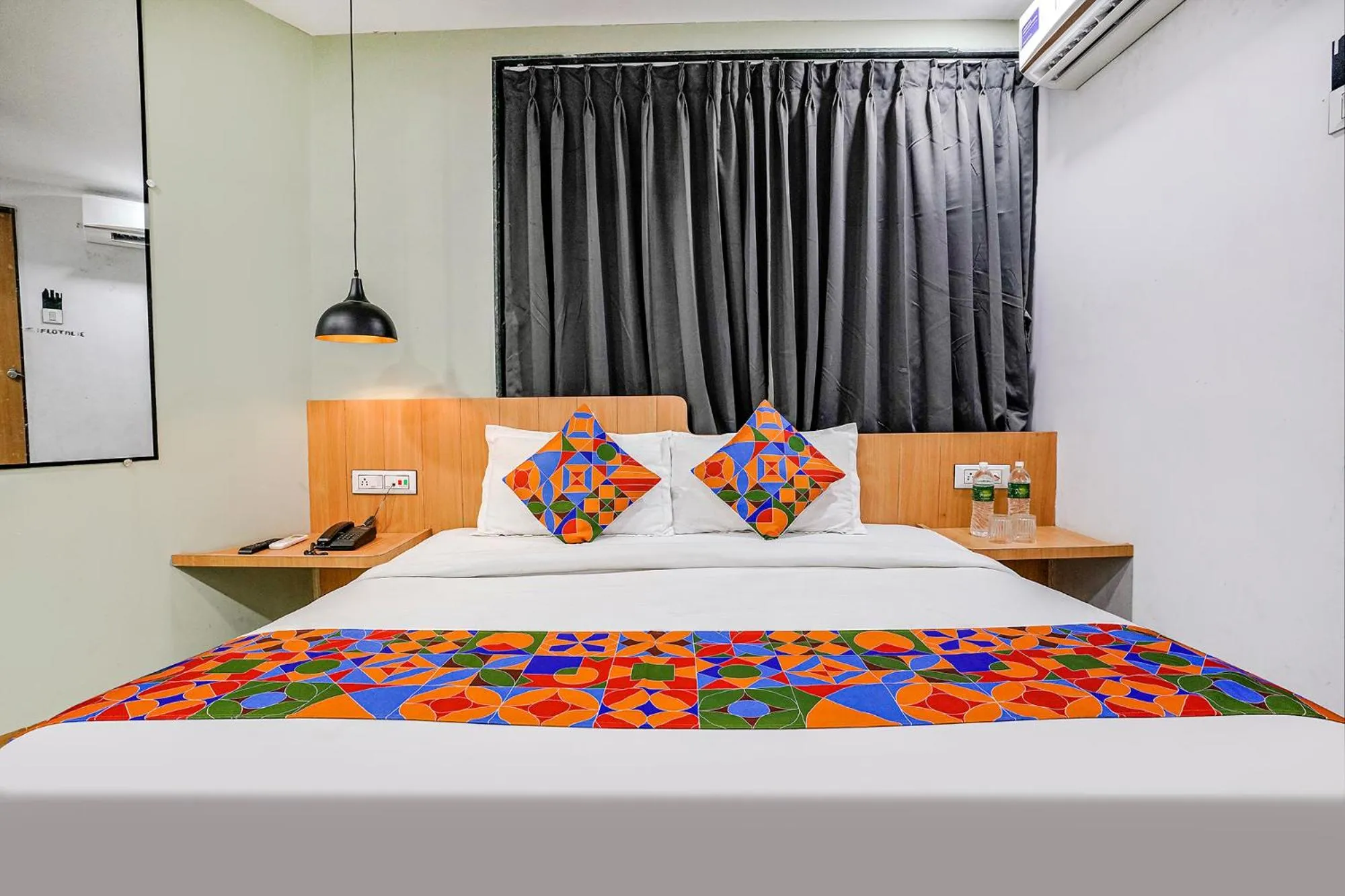 Bed in FabHotel Saarthi Inn