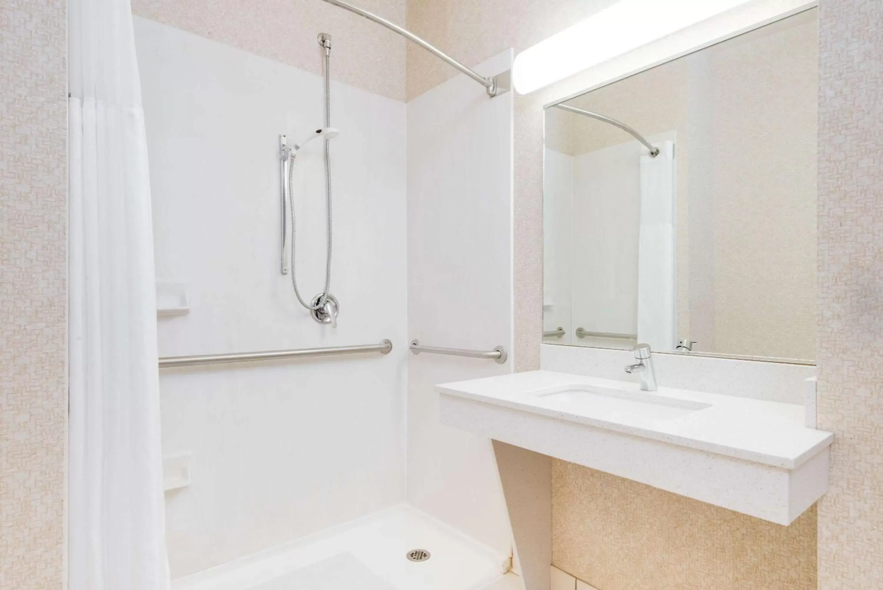 Bathroom in Wingate by Wyndham Gillette near CAM-PLEX