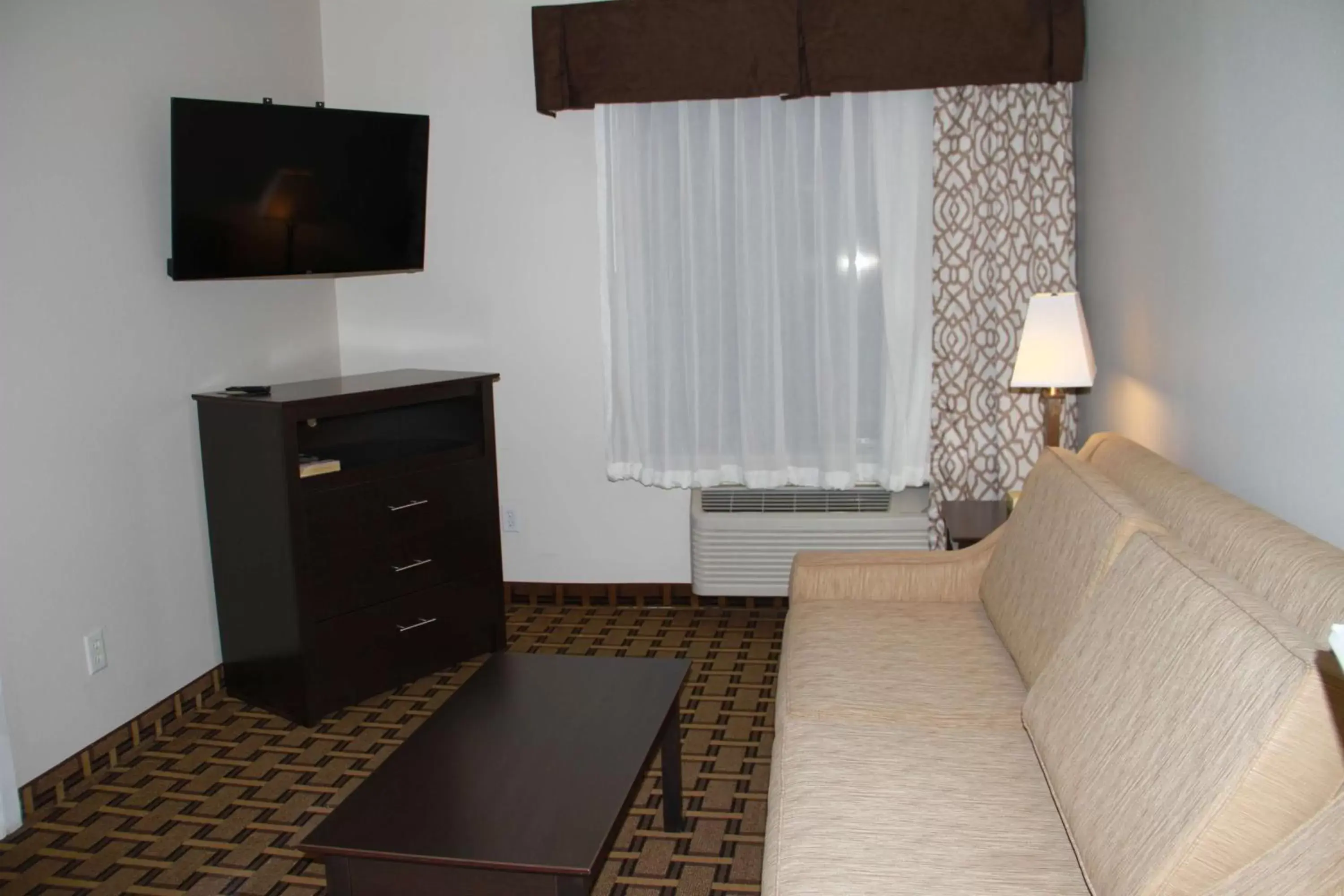 Photo of the whole room, TV/Entertainment Center in SureStay Plus Hotel by Best Western Coralville Iowa City