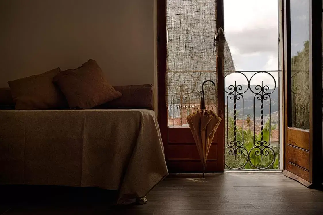 Bed, Seating Area in B.E.A. Maison