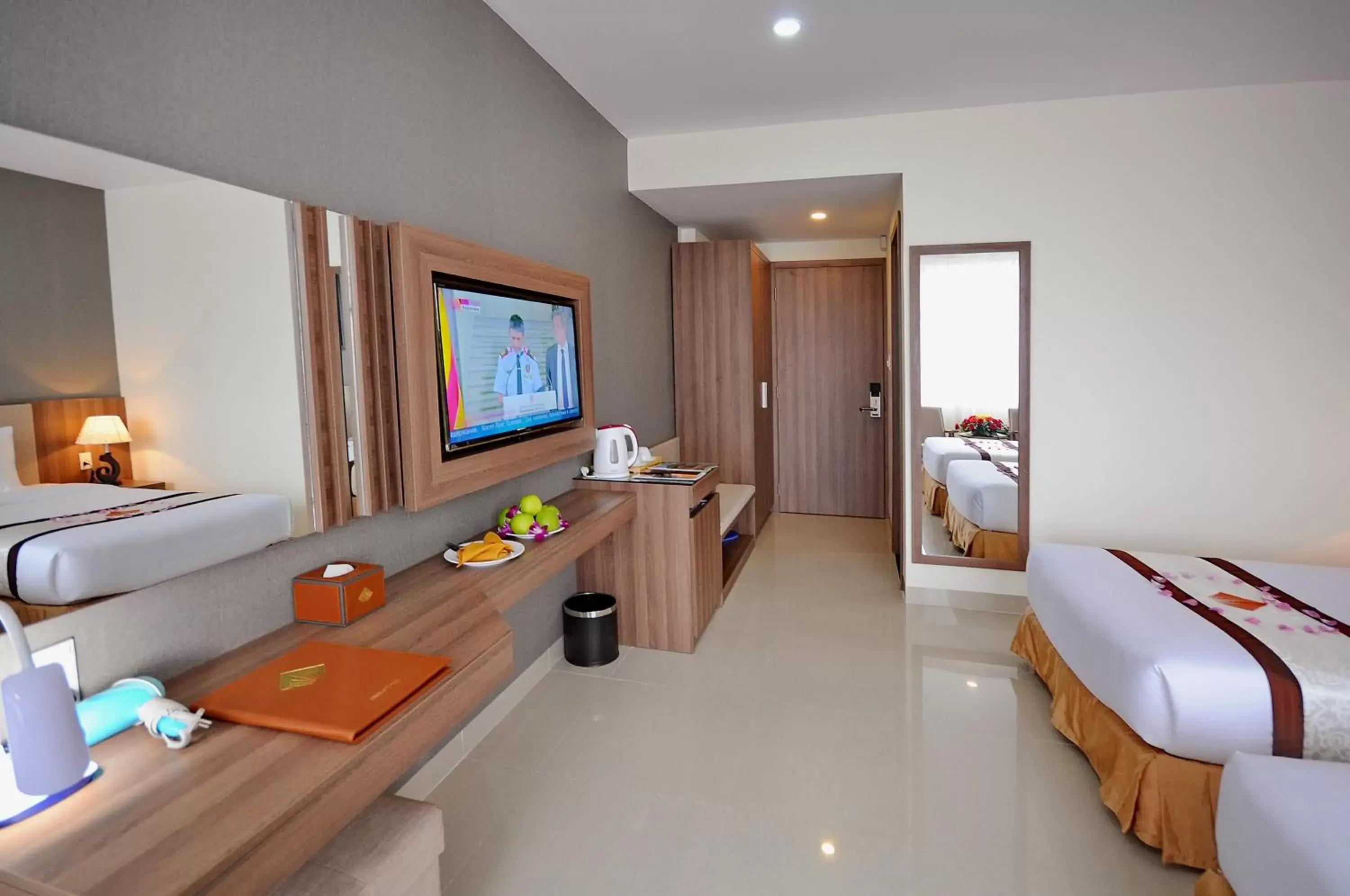 Bedroom, TV/Entertainment Center in Rigel Hotel