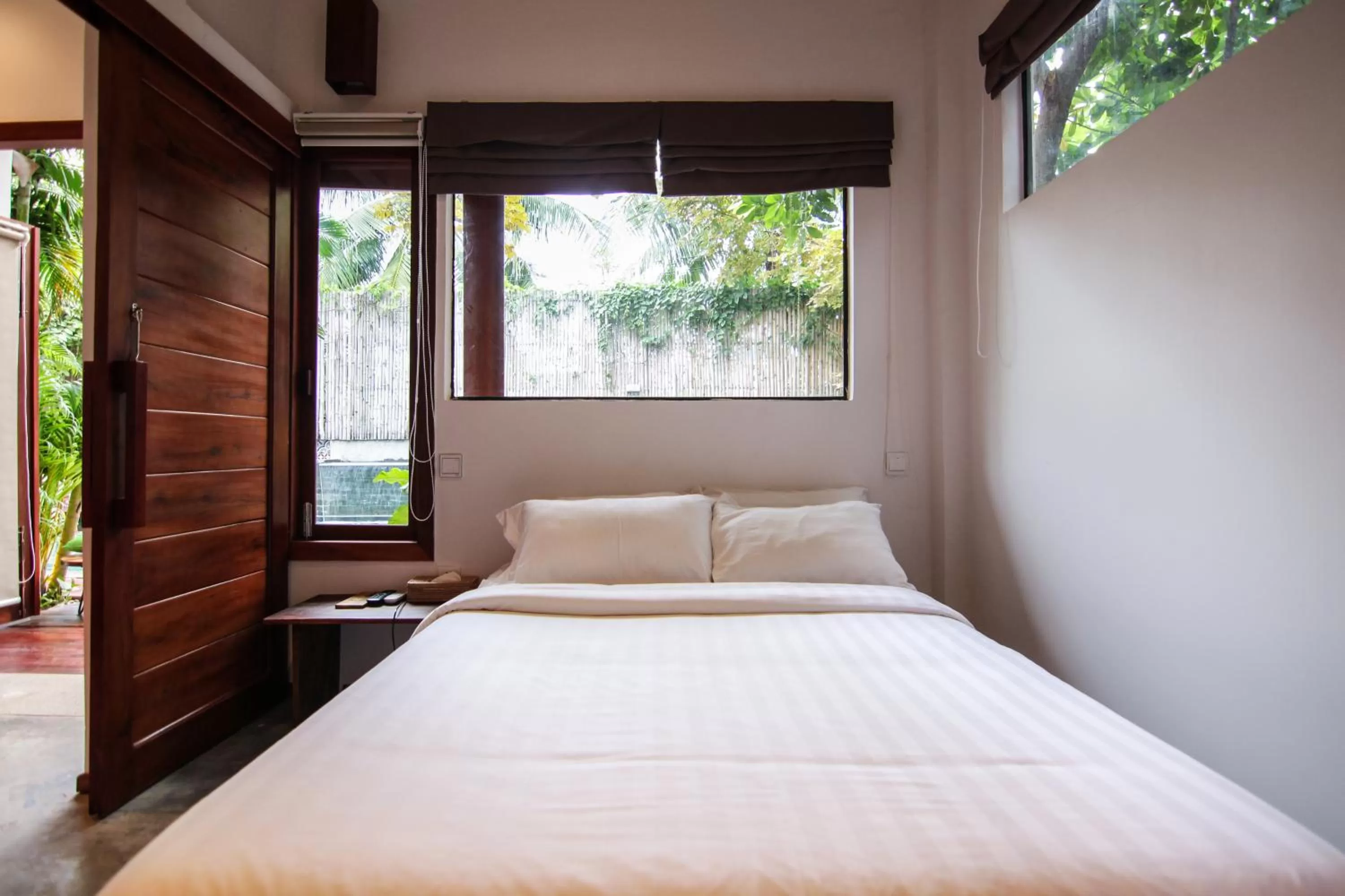 Bed in Sarina Hotel & Villa