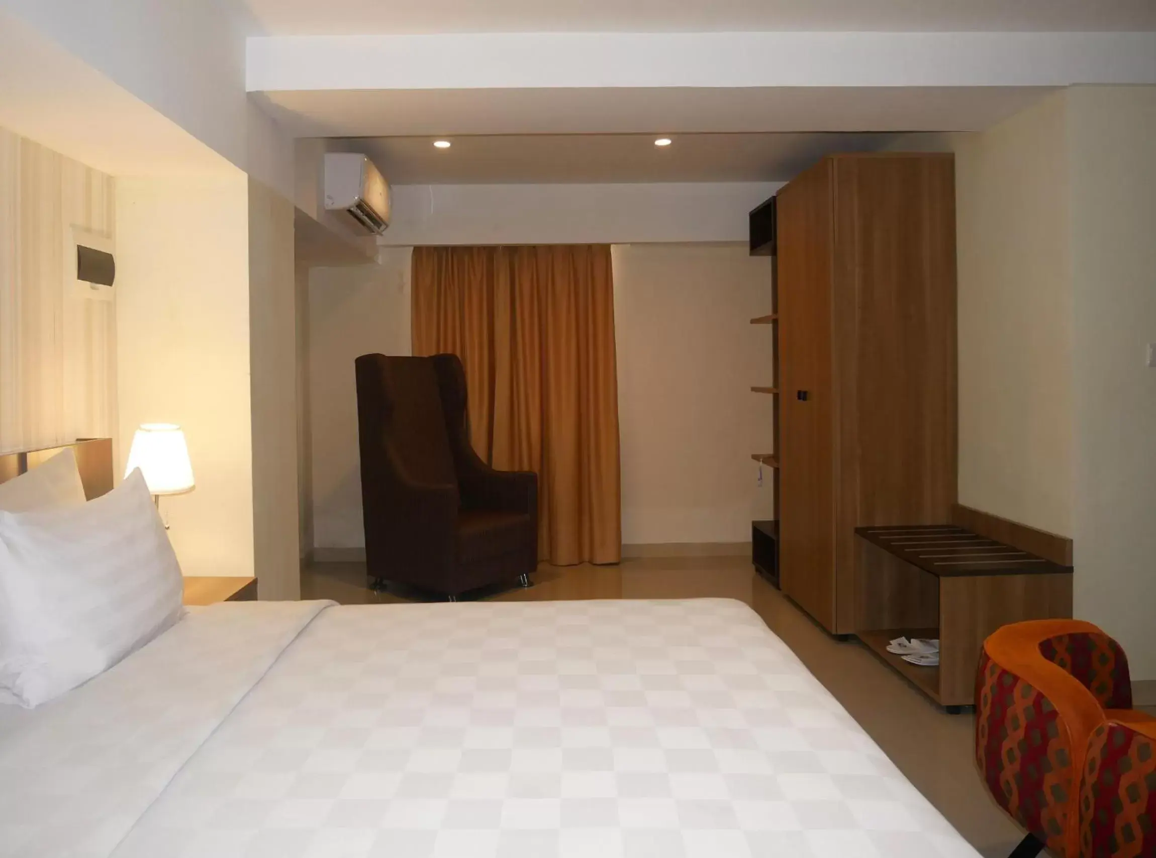 Bed in Swiss-Belhotel Makassar